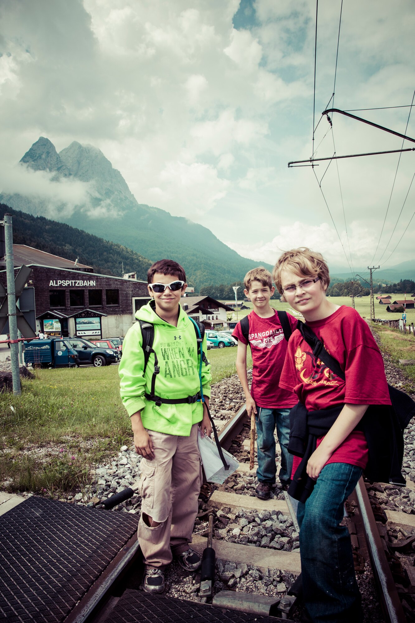 Paul Bake, Nick Repak and Evan Karrs, Boy Scouts from Troop 165 of Spangdahlem Air Base, Germany, pose for a photo while participating in a five-mile hike during a weeklong summer camp July 23, 2014, near Garmisch, Germany.  The camp provided opportunities for the boy scouts to learn how to start a fire, cook a cobbler in a dutch oven, carve wood, shoot rifles and learn how to live by the Scout Oath, Scout Law and Scout Motto.  (Courtesy Photo/Released)