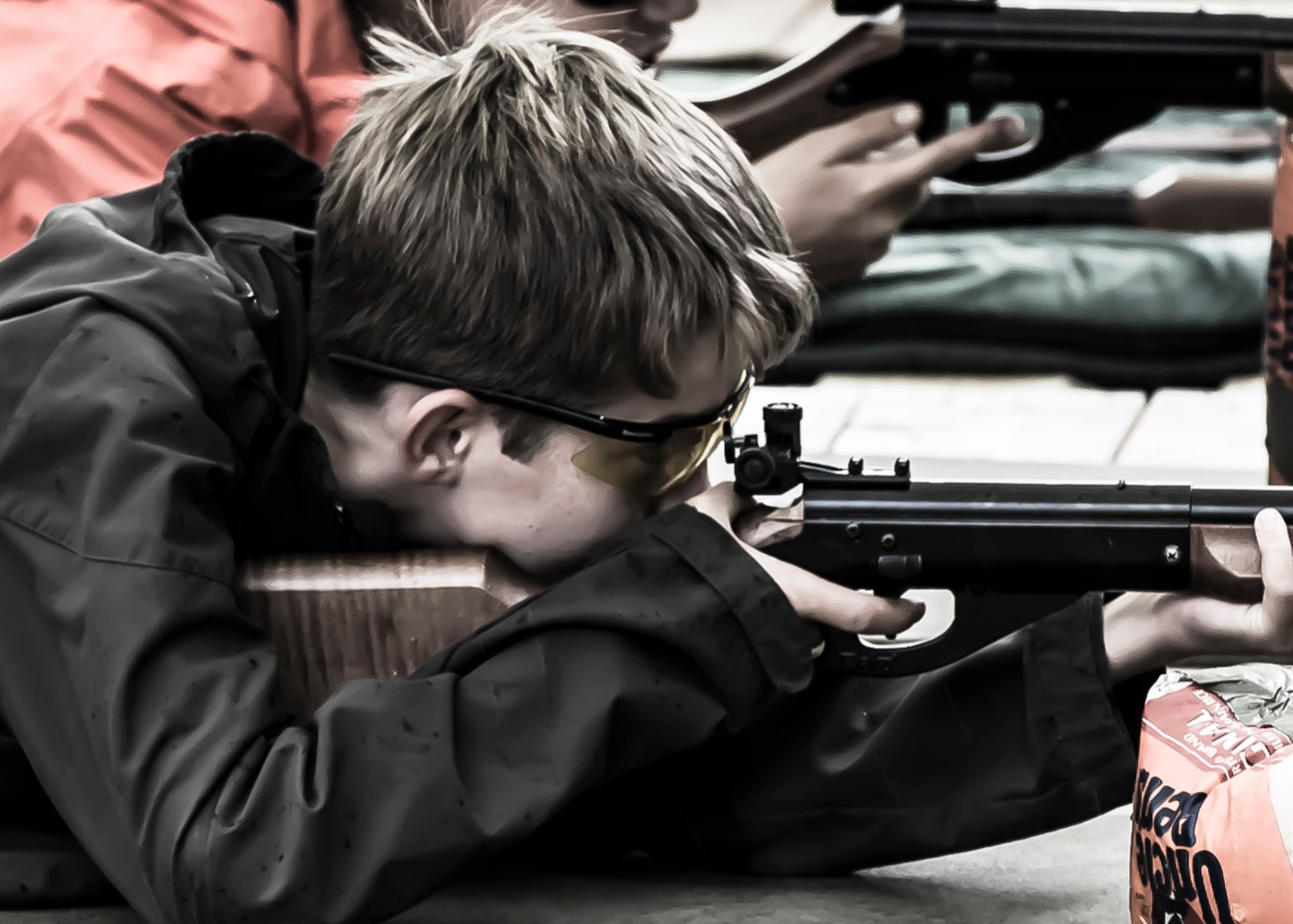 Nick Repak, of Boy Scout Troop 165 from Spangdahlem Air Base, Germany, shoots a rife for a merit badge qualification during a weeklong summer camp July 20, 2014, near Garmisch, Germany.  Boy scout troops from Frankfurt, Ramstein, Naples, Netherlands, Belgium, and the U.S. attended the camp. (Courtesy Photo/Released)