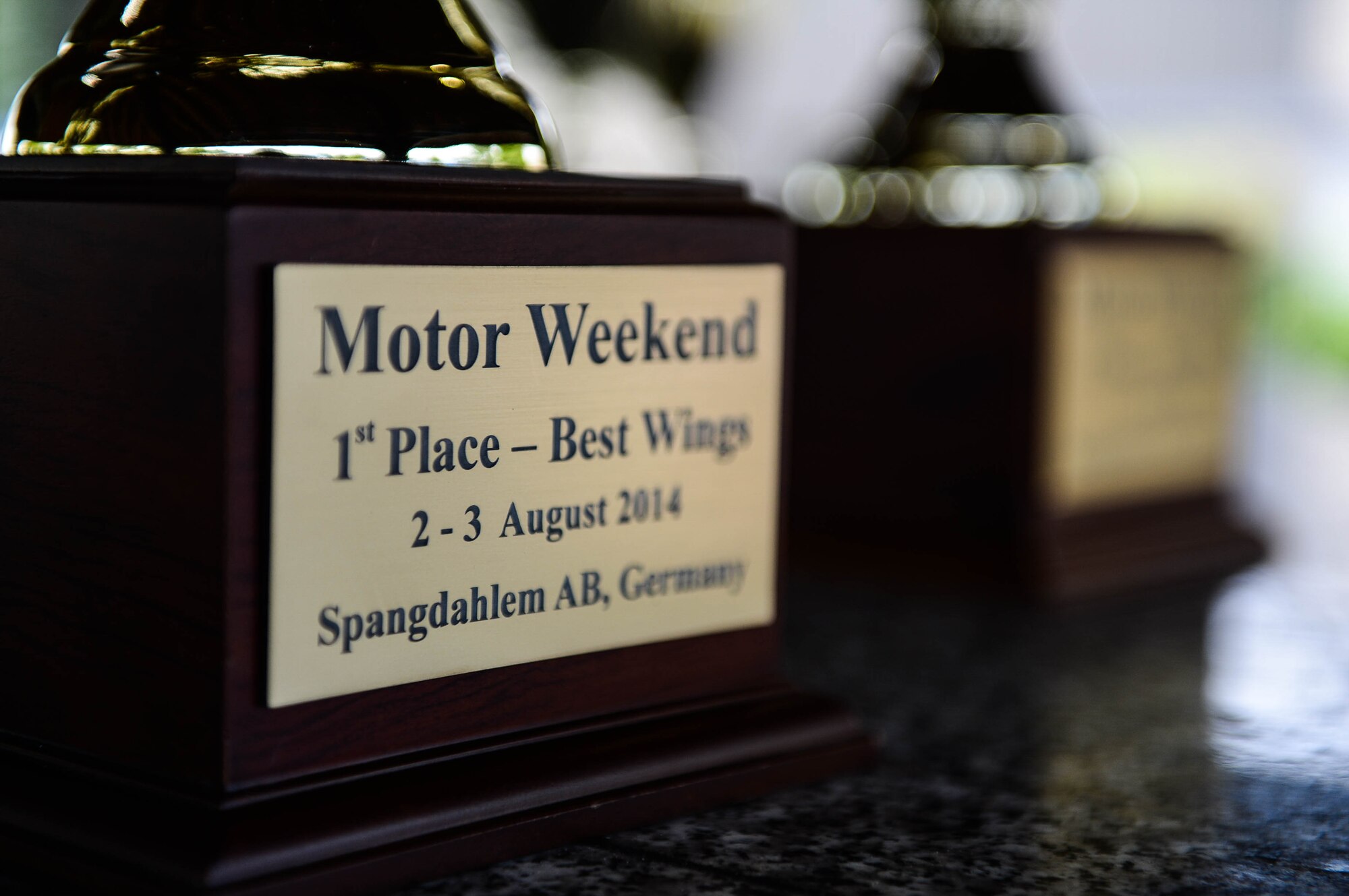 A first-place place trophy is displayed in the Motor Weekend car show at Spangdahlem Air Base, Germany, Aug. 2, 2014. U.S. Air Force Master Sgt. Martin Lerch, barbeque contestant and Riverside, Calif., native, was the first place winner for having the best barbeque wings and ribs. (U.S. Air Force photo by Airman 1st Class Kyle Gese/Released)