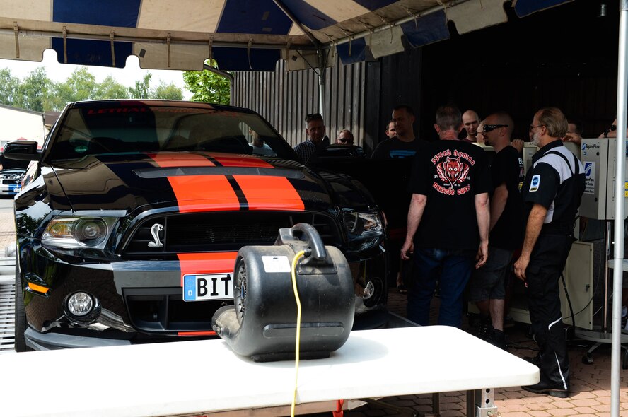 Judges run tests on U.S. Air Force Staff Sgt. Josh Hoke's car, a Motor Weekend competitor and Whitney, Texas native, at Spangdahlem Air Base, Germany, Aug. 2, 2014. The judges measured the output of the 2012 Ford Shelby GT-500 rear-wheel horsepower. The owner with the highest output received a trophy. (U.S. Air Force photo by Airman 1st Class Kyle Gese/Released)