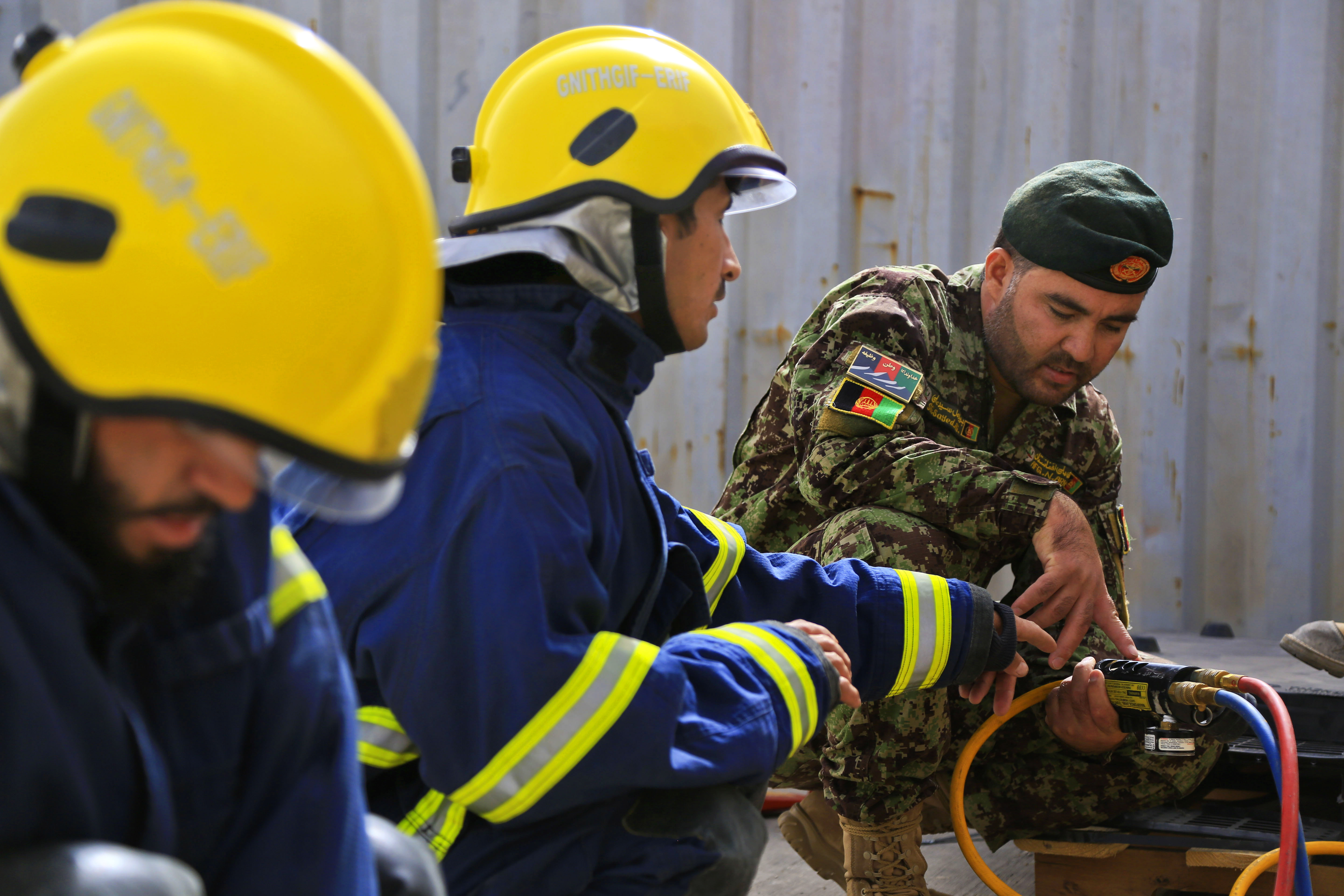 Afghan soldiers conduct drills inflating and deflating rubber air jacks