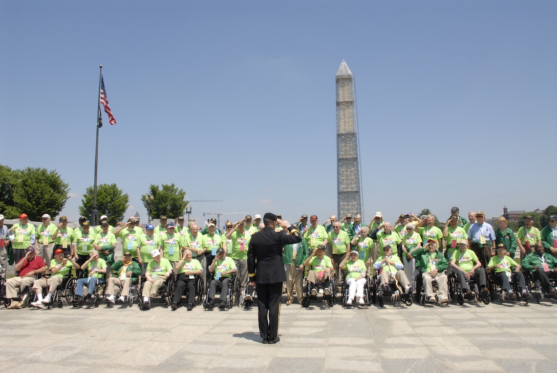 Lt. Gen. Michael Flynn salutes honor flight veterans at the National Mall in Washington, D.C., June 8, 2013. 