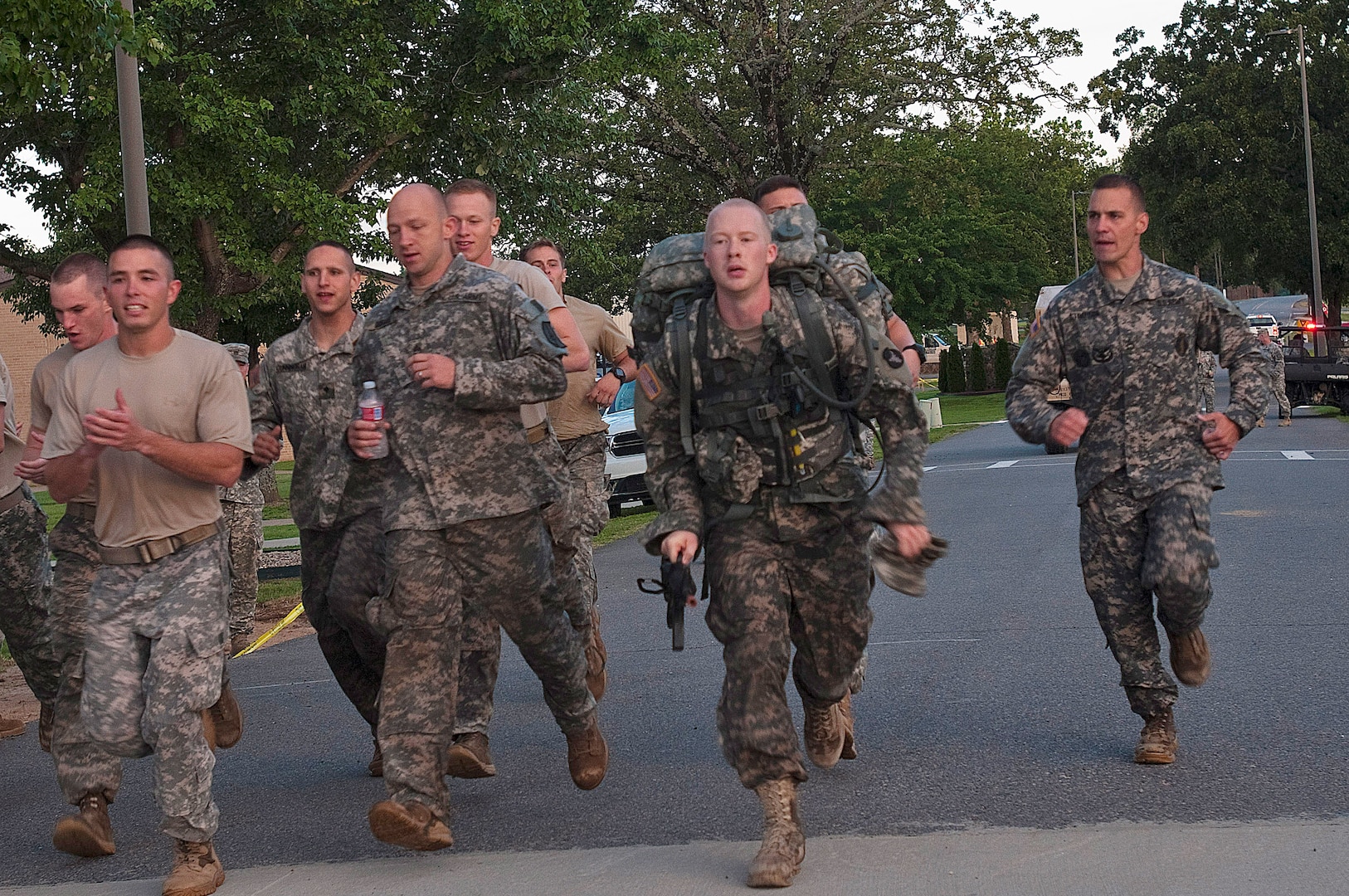 Competitors in 2014 Army National Guard Best Warrior Competition cross the finish line of the ruck march portion of the competition at Camp Joseph T. Robinson, Arkansas, July 16, 2014. The competition tested competitors on a variety of tactical and technical skills in a physically and mentally demanding environment as they vie to earn the title of Best Warrior and become the Soldier and Noncommissioned Officer of the Year for the Army Guard. The winners of the competition will go on to represent the Army Guard in the Department of the Army level Best Warrior Competition later this year. 