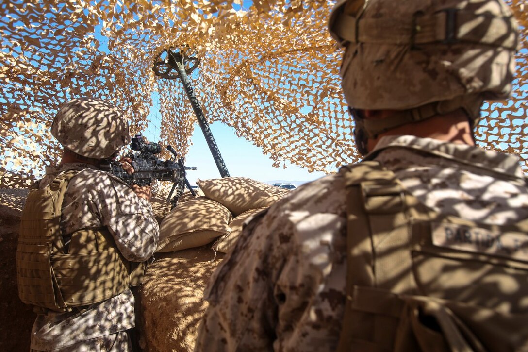 Lance Cpl. Jared Oden, left, from Pleasant, Ala. and LCpl. Francisco Partida from Perris, Calif., both military police officers with 1st Law Enforcement Battalion, Brigade Headquarters Group, 1st Marine Expeditionary Brigade, post perimeter security during Large Scale Exercise 2014 in Camp Francis aboard Marine Corps Air Ground Combat Center Twentynine Palms, Calif., Aug. 5. LSE-14 is a bilateral training exercise being conducted by 1st MEB to build U.S. and Canadian forces’ joint capabilities through live, simulated, and constructive military training activities from Aug. 8-14. (U.S. Marine Corps photo by Cpl. Rick Hurtado/Released)