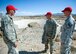 (From left) Airman 1st Class Christopher Fitzgerald, Tech. Sgt. Adam Dixon and Staff Sgt. James Maxwell check out the spot where a car, belonging to an elderly couple they saved from a flash flood, ended up on U.S. Route 95 north of Las Vegas, Nev., Aug. 5, 2014. During the rescue, Dixon and Maxwell held the car door open so Fitzgerald could reach in, grab and carry the woman to higher ground. Fitzgerald, Dixon, Maxwell are members of the 820th RED HORSE at Nellis Air Force Base, Nev. (U.S. Air Force photo/Staff Sgt. Siuta B. Ika)