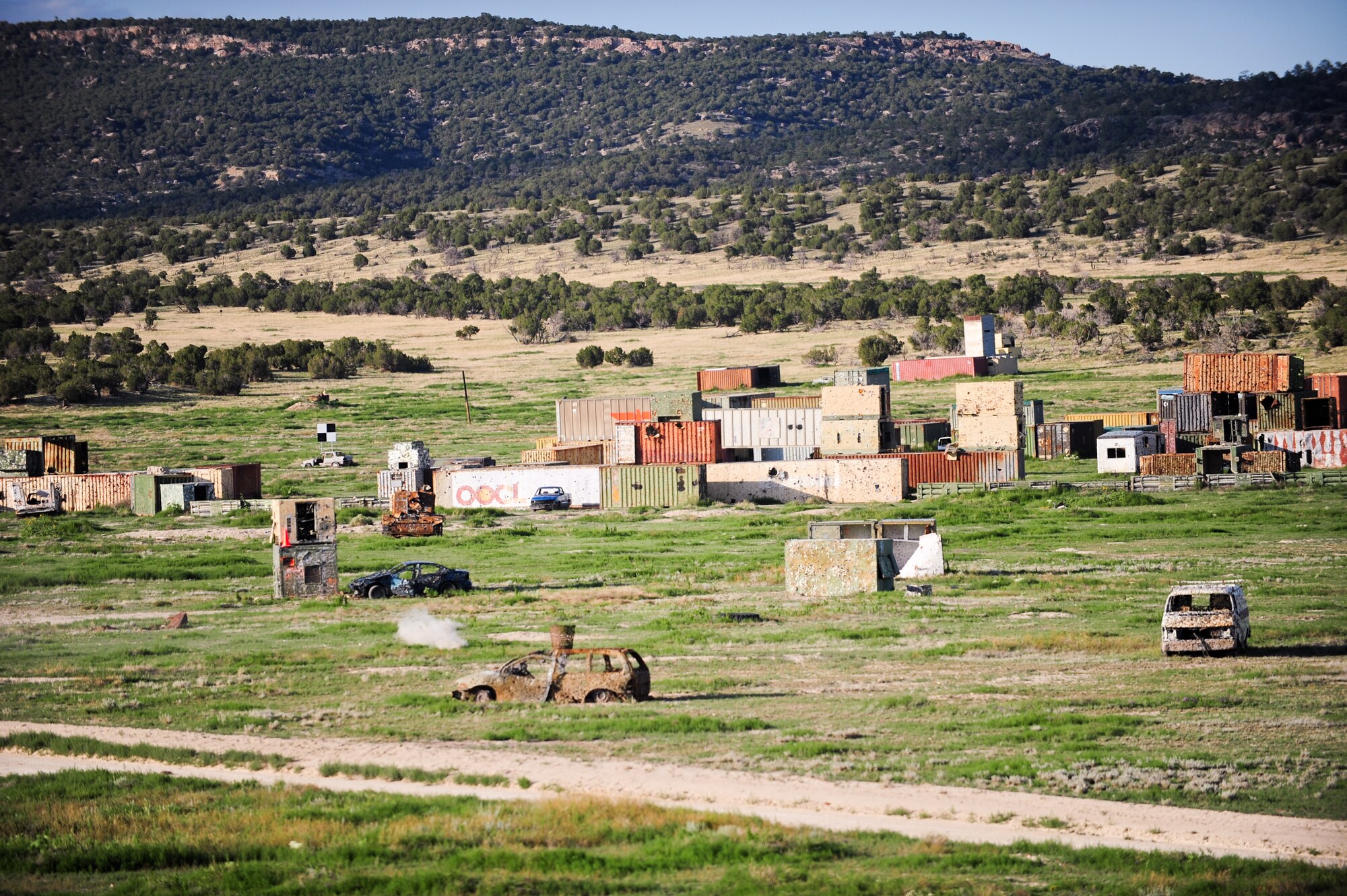 Air Force Reservists fire upon random targets August 2, 2014, at Fort Carson’s Airburst range in Pueblo, Colo. The 310th and 710th Security Forces Squadrons held their annual live fire training during the August unit training assembly weekend.