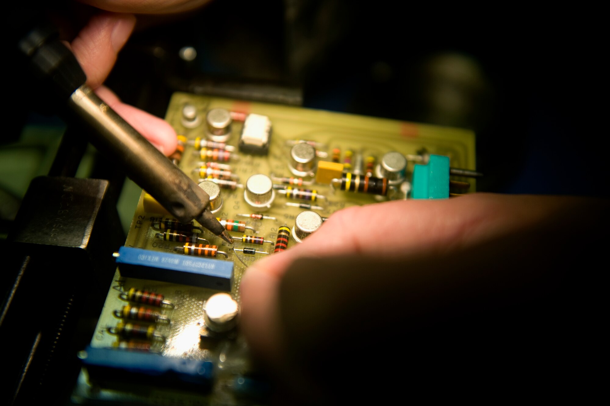 Staff Sgt. Tyle Wilson, 57th Maintenance Group Air Force Repair and Enhancement Program technician, works on an electrical piece of an aircraft at Nellis Air Force Base, Nev., Aug. 4, 2014. For every piece of repaired equipment the 57th MXG’s flight service center accepts, the AFREP shop receives full credit for the cost of the part, which goes back into the group and wing funds to improve the base. (U.S. Air Force photo by Staff Sgt. Siuta B. Ika)