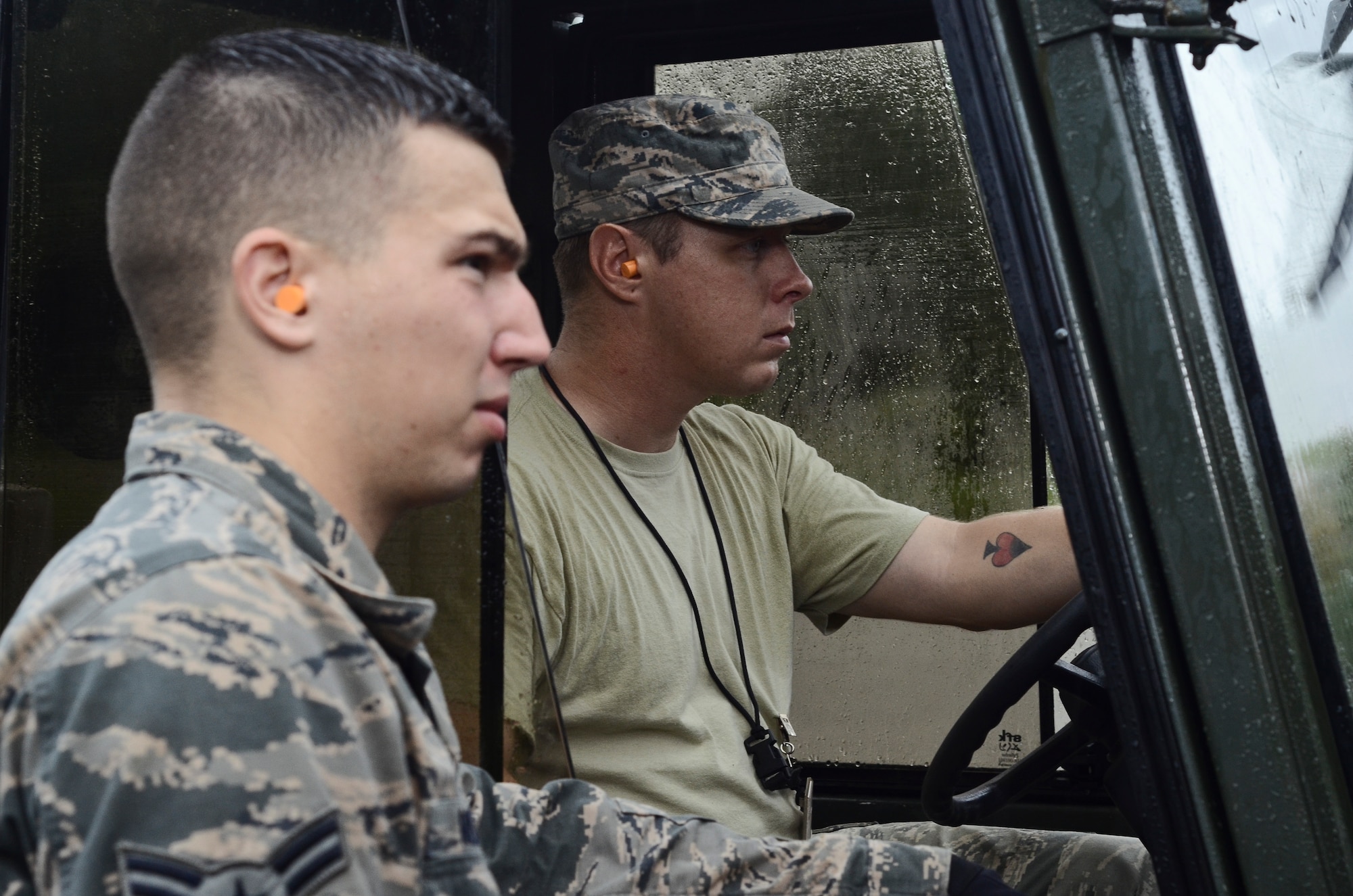 Senior Airman Brian Fish (left), listens to Airman 1st Class Jack Mowery (right), both 36th Munitions Squadron Material Flight storage crew members, as he explains where to drop a pallet of guidance controlled units July 30, 2014, on Andersen Air Force Base, Guam. The 36th MUNS is home to the largest munition stock pile in the world, valued at $1.3 billion, the material flight also ensures proper storage practices are utilized, inspect and maintain the munitions and ensure accountability of over 9 million individual items. (U.S. Air Force photo by Staff Sgt. Robert Hicks/Released)