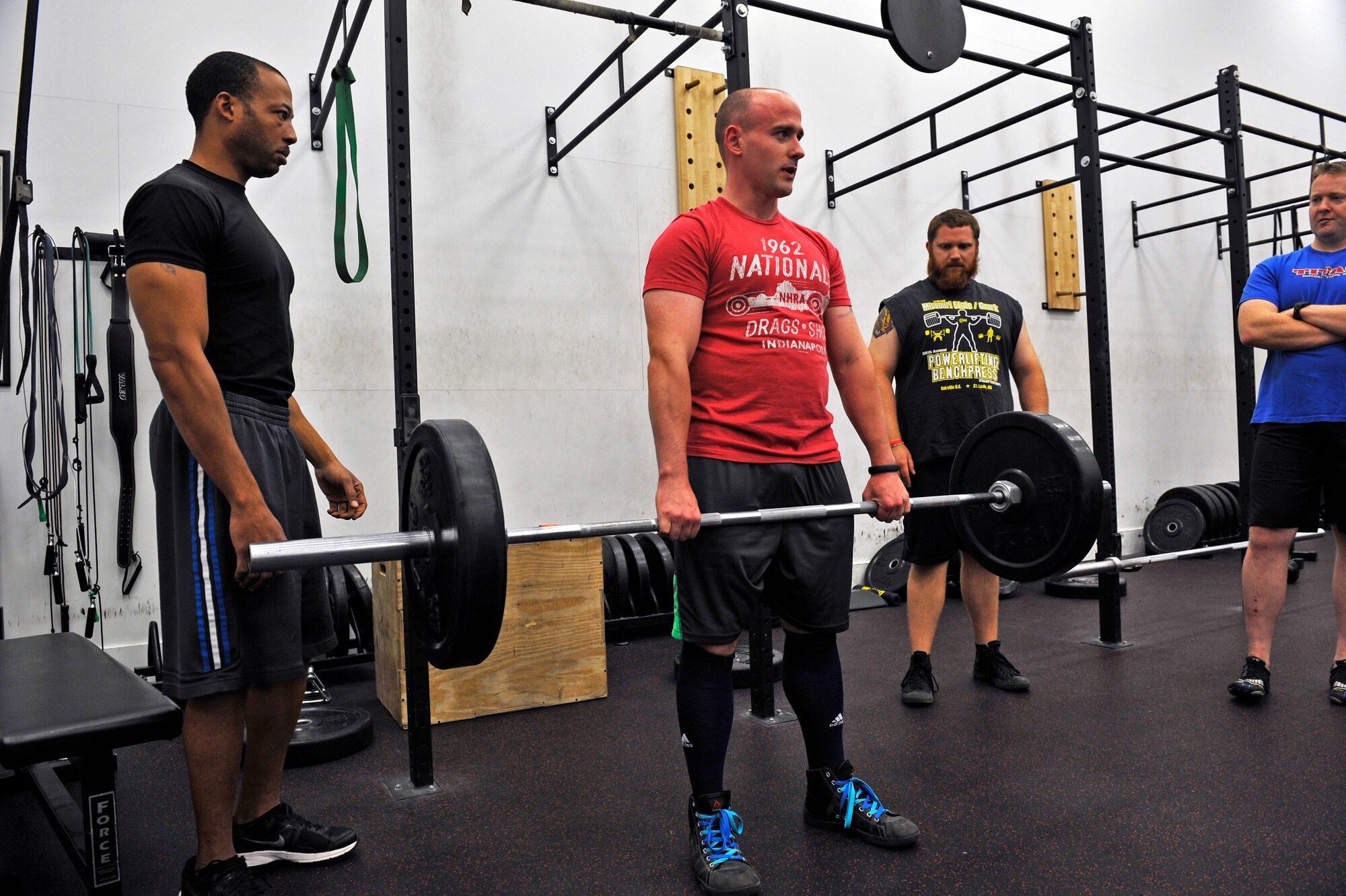 Tech. Sgt. Brad Lego demonstrates a deadlift to a class interested in powerlifting at the James Sports Center, Scott Air Force Base, Ill., July 31, 2014. Lego holds a state record for the deadlift at 556.5 pounds. (U.S. Air Force photo by Airman 1st Class Erica Crossen)
