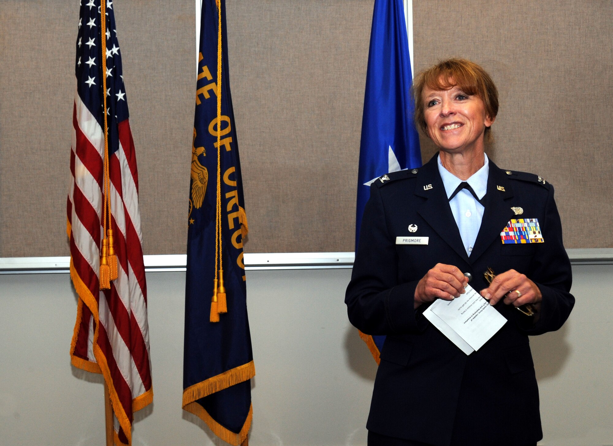Newly promoted Col. Donna Prigmore addresses the Airmen and others in attendance for the 142nd Mission Support Group Change of Command ceremony, Portland Air National Guard Base, Ore., Aug. 3, 2014. (U.S. Air National Guard photo by Tech. Sgt. John Hughel, 142nd Fighter Wing Public Affairs/Released)