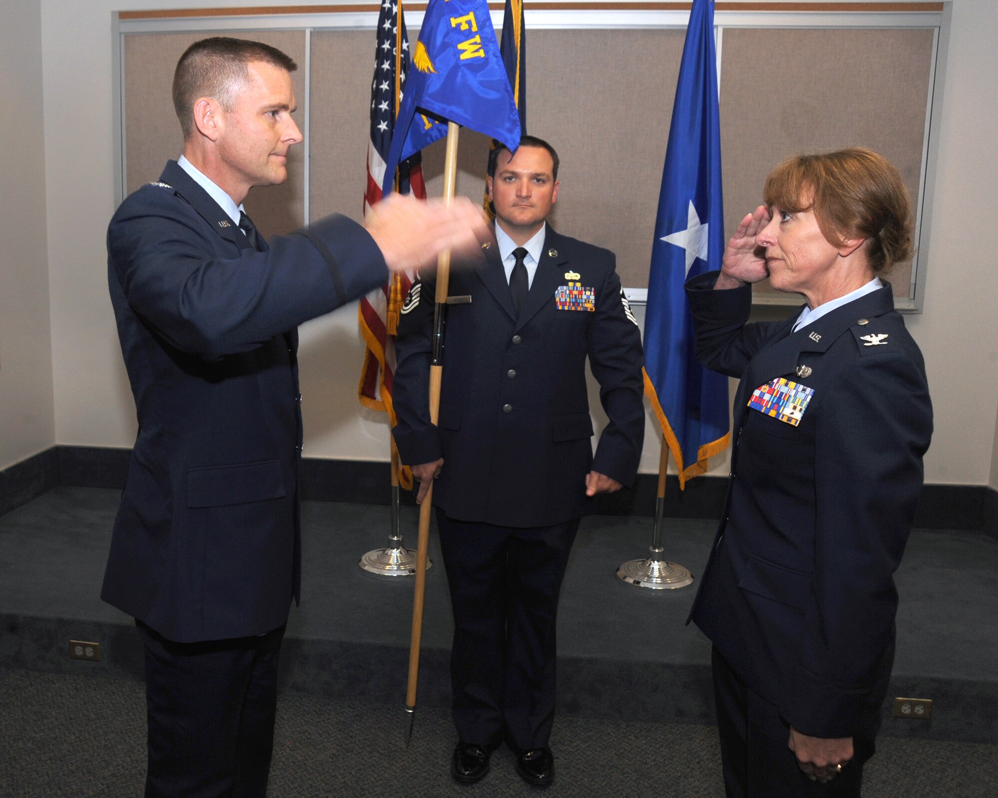 Col. Rick Wedan, 142nd Fighter Wing Commander, left, returns the salute form the new 142nd MSG Commander Col. Donna Prigmore, right, during the Mission Support Group Change of Command Ceremony, Portland Air National Guard Base, Ore., Aug. 3, 2014. (U.S. Air National Guard photo by Tech. Sgt. John Hughel, 142nd Fighter Wing Public Affairs/Released)