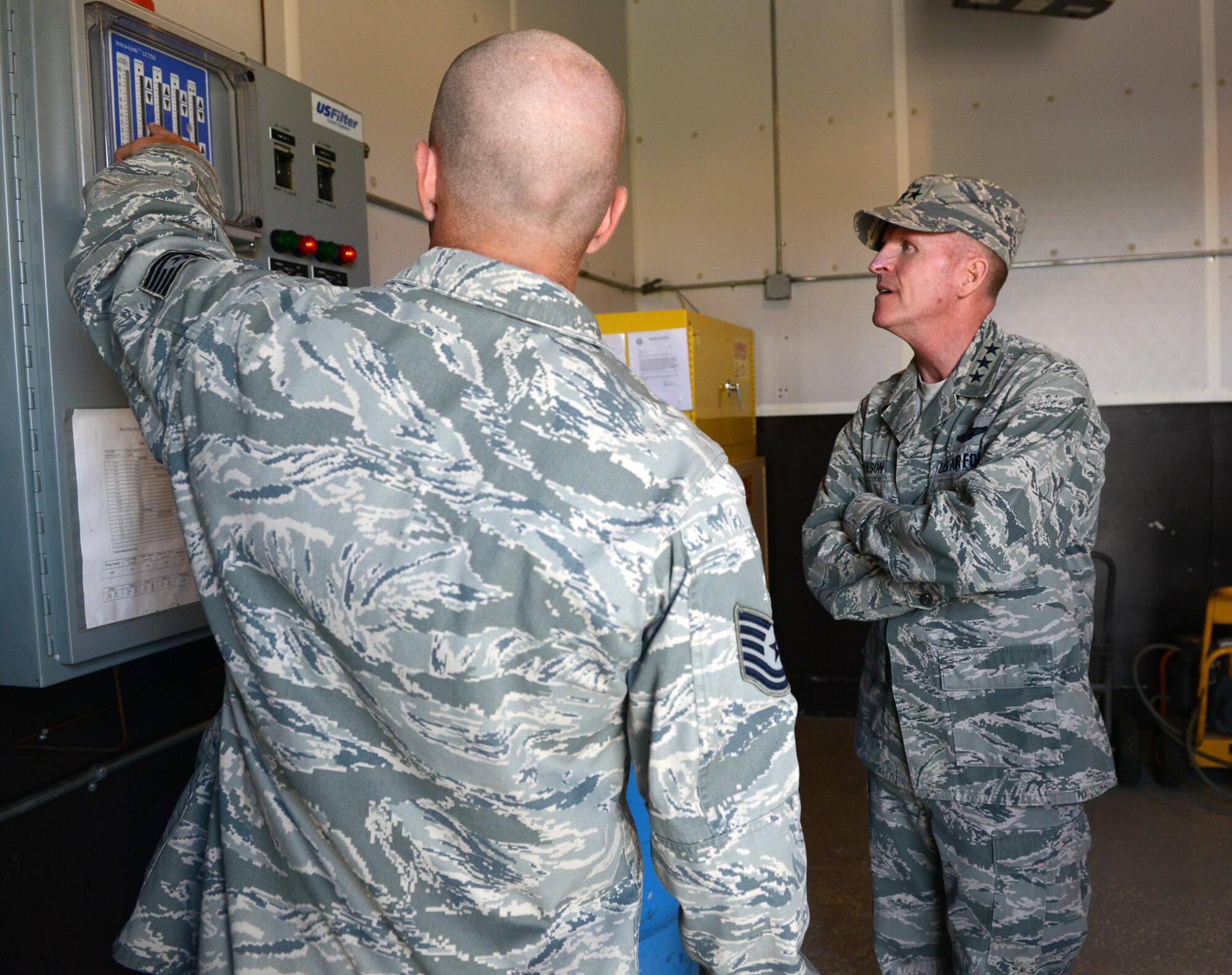 Tech. Sgt. Justin Jones, 12th Missile Squadron facility manager, shows the level of water in the D-154 controller tank to Lt. Gen. Stephen Wilson, Air Force Global Strike Command commander, during a tour of India 1 missile alert facility Aug. 5. As part of his three-day visit to Malmstrom Air Force Base Aug. 4 to 6, Wilson interacted with security forces members, missileers and chefs during his tour of the MAF. (U.S. Air Force photo/Senior Airman Katrina Heikkinen)