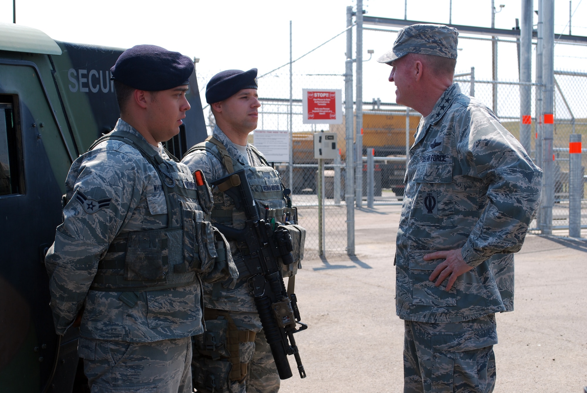 Airmen 1st Class Jesse Whitworth (left), and Geovanie Medina-Moreno, 341st Security Forces Squadron members, give Lt. Gen. Stephen Wilson, Air Force Global Strike Command commander, a post-brief at the Weapons Storage Area at Malmstrom Air Force Base Aug. 5. Wilson visited the base Aug. 4 to 6 to share his top priorities for the future of AFGSC. (U.S. Air Force photo/Senior Airman Katrina Heikkinen)