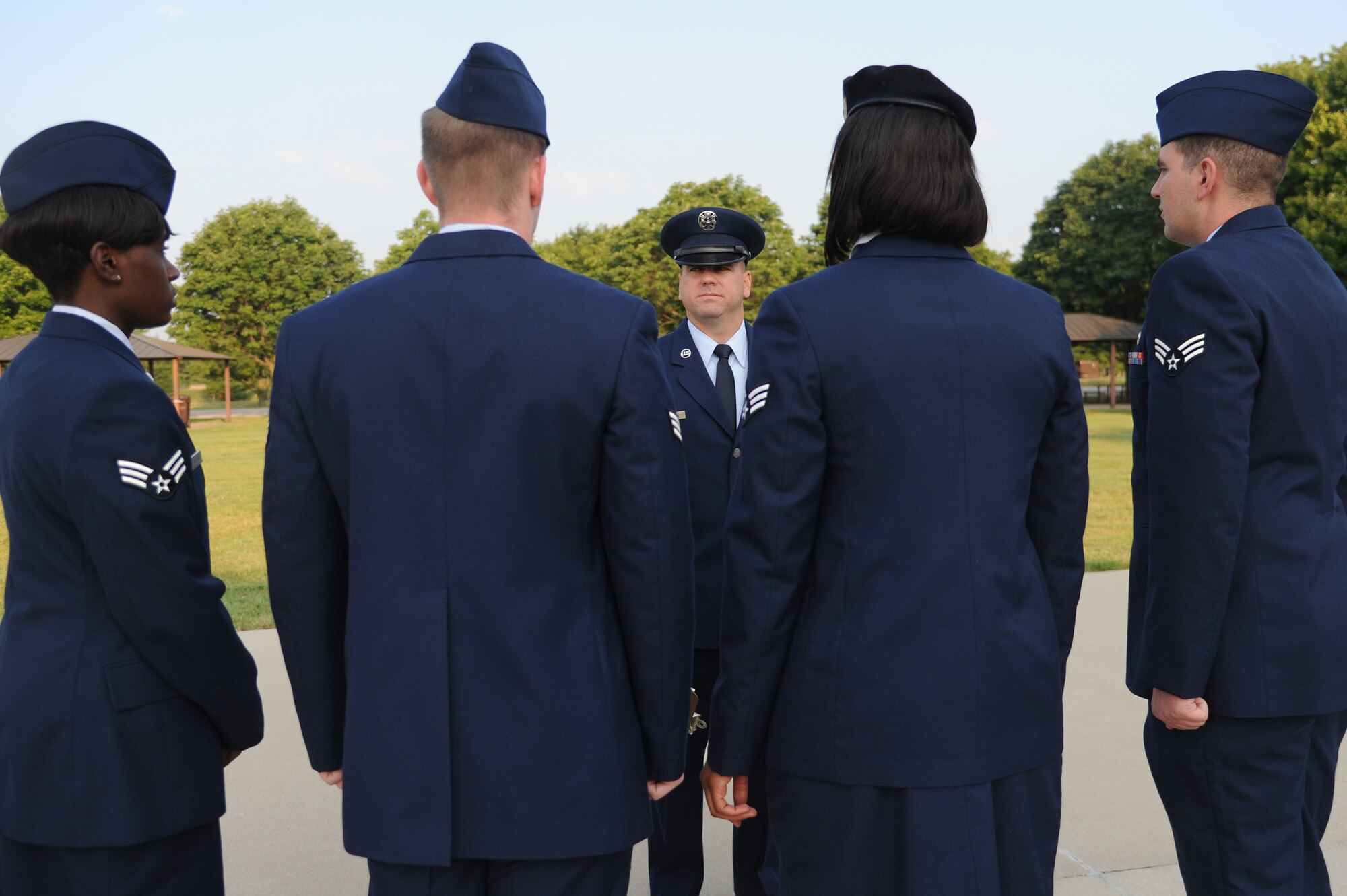 Tech. Sgt. Jeremy Zimmerman, 375th Force Support Squadron's Airman Leadership School instructor, talks to the element leaders uniforms during a blues inspection Aug. 1,2014 at Scott Air Force Base, Ill. Airmen have three uniform inspections during their time at ALS. During the inspection the instructor checks the ribbons, function badge, name tag and uniform. (U.S. Air Force photo/ Senior Airman Tristin English)