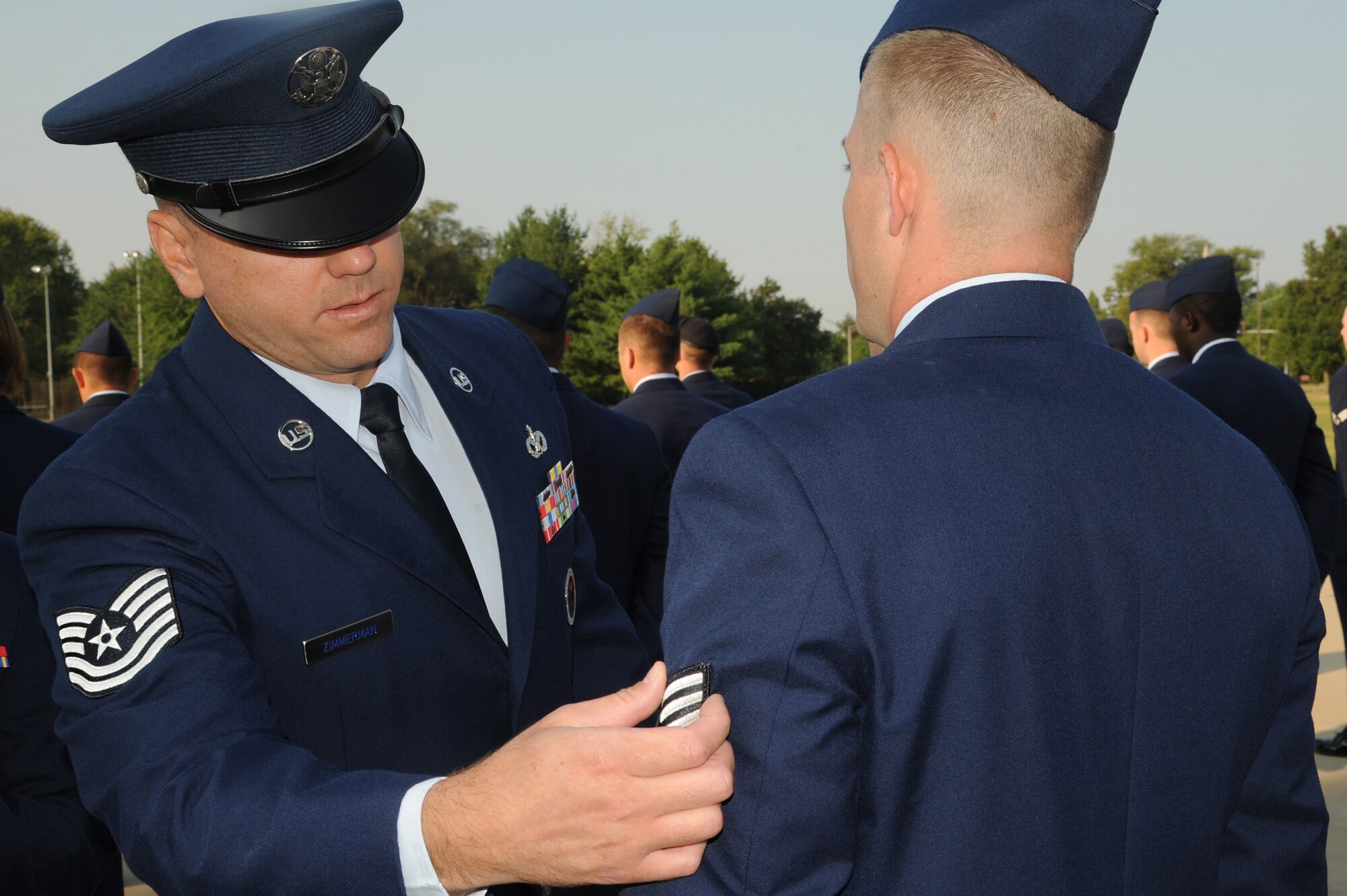 Tech. Sgt. Jeremy Zimmerman, 375th Force Support Squadron's Airman Leadership School instructor, inspects the students uniforms during a blues inspection Aug. 1,2014 at Scott Air Force Base, Ill. During the course of ALS they will have uniform inspections, tests, and writing assignments. (U.S. Air Force photo/ Senior Airman Tristin English)