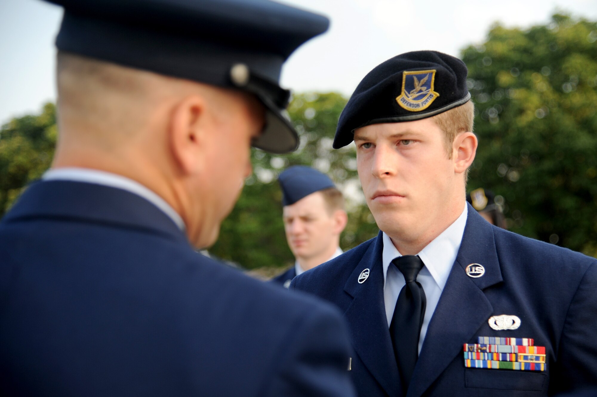 Tech. Sgt. Jeremy Zimmerman, 375th Force Support Squadron's Airman Leadership School instructor, inspects the uniform of Senior Airman Christopher Balderas during a blues inspection, Aug. 1,2014 at Scott Air Force Base, Ill. Students attending ALS are new or future staff sergeants and spend the academic days learning the skills and tools to become and effective NCO.