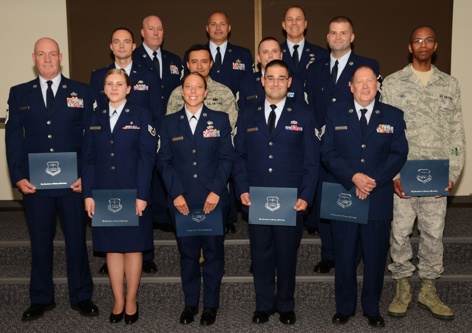 Members of the 103rd Airlift Wing receive their associate’s degrees in various fields during the Community College of the Air Force commencement held on Aug. 3, 2014, at Bradley Air National Guard Base, East Granby, Conn. The CCAF is now a requirement for enlisted Airmen to become a Senior Master Sgt. or Chief Master Sgt. (U.S. Air National Guard photo by Senior Airman Jennifer Pierce/Released)