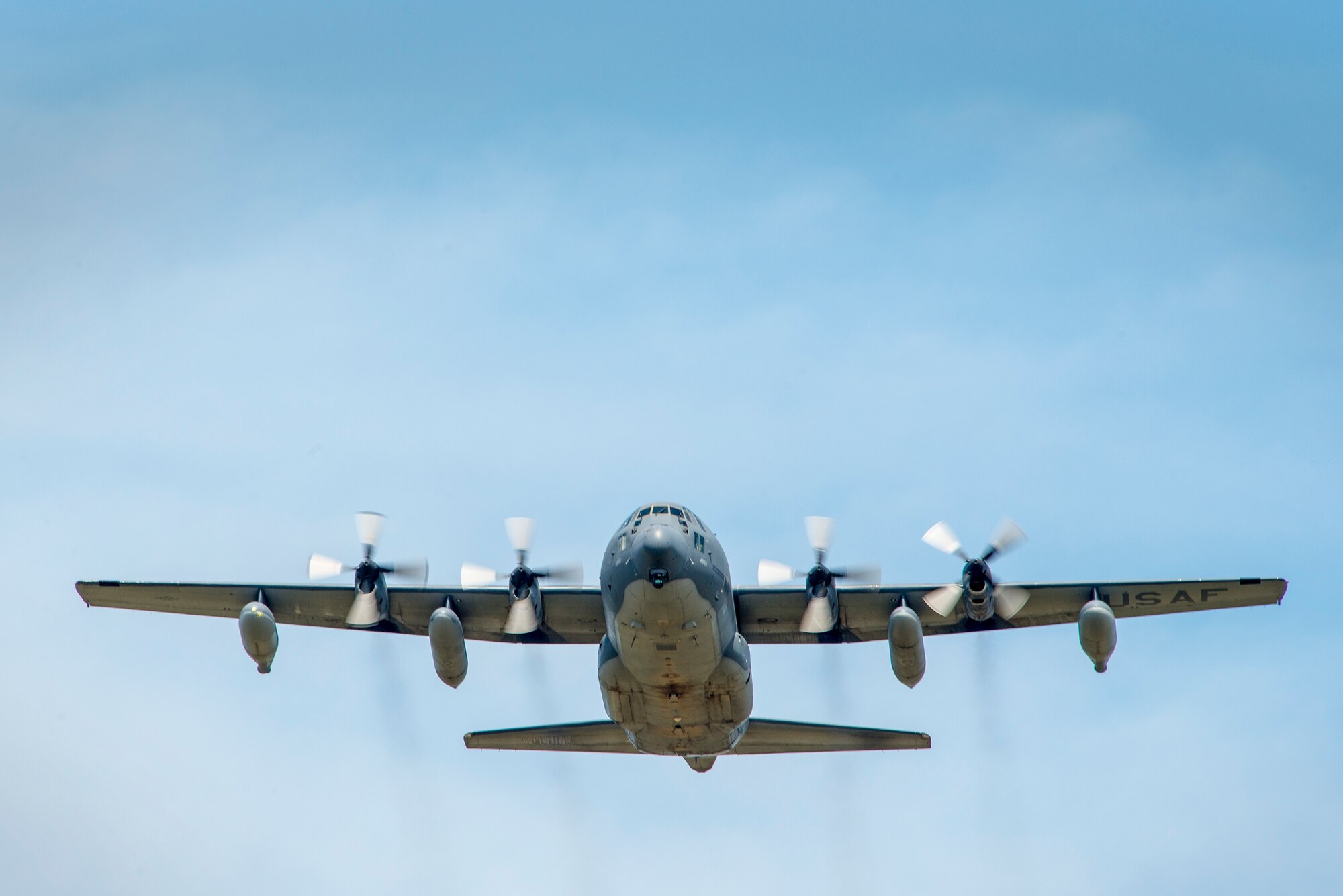 An HC-130P Combat King assigned to the 71st Rescue Squadron flies overhead at Moody Air Force Base, Ga., Aug. 5, 2014. The aircraft and the Airmen onboard returned to Moody after a five-month deployment in support of Air Forces Africa, completing the final deployment for active-duty HC-130Ps. (U.S. Air Force photo by Airman 1st Class Ryan Callaghan/Released)