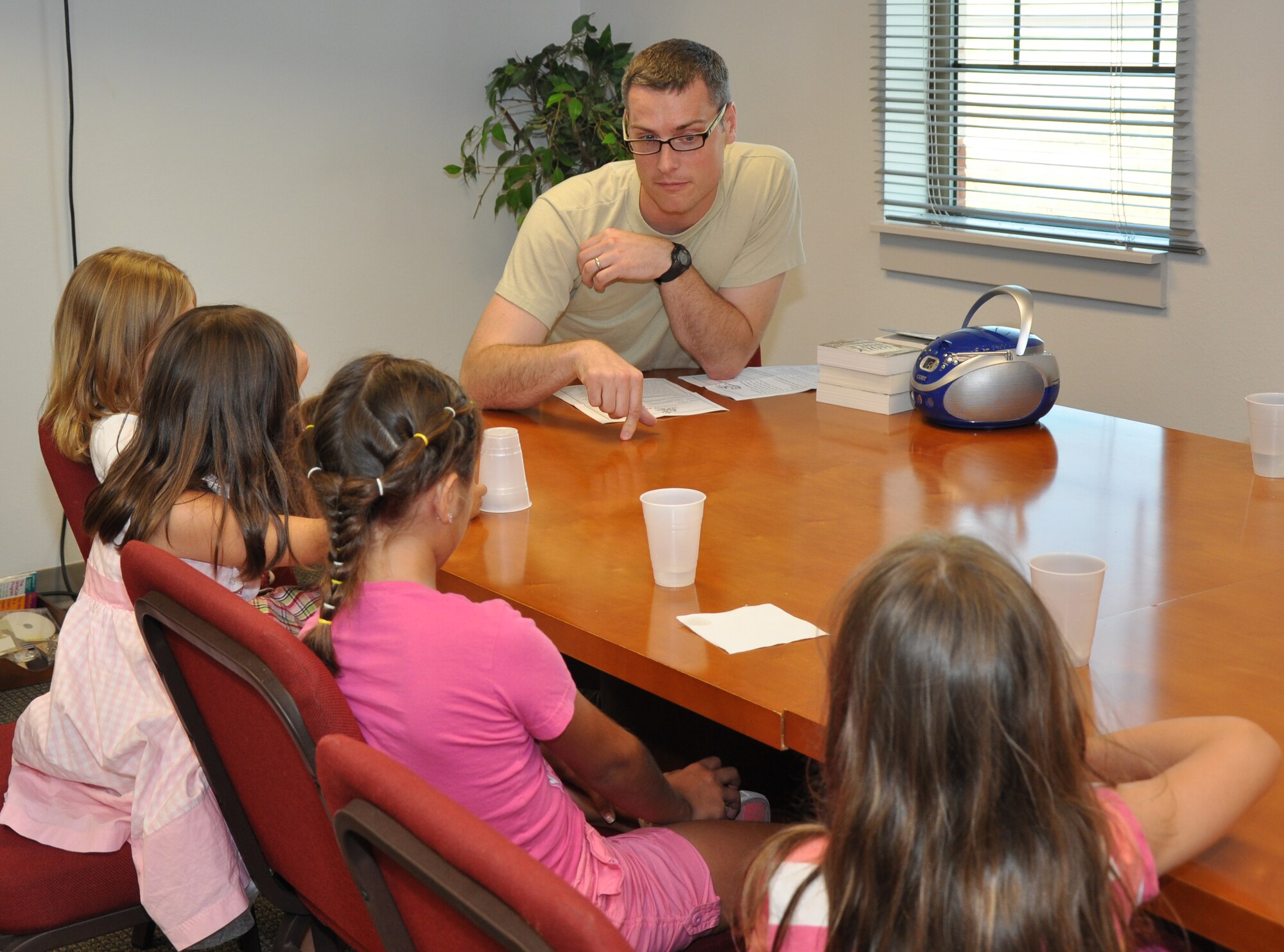 GOODFELLOW AIR FORCE BASE, Texas – Second Lt. Daniel C. Wilton, 17th Training Wing chaplain candidate, talks to children about friendship and honesty during the God in my Backpack Vacation Bible School at the Taylor Chapel here July 24. Wilton shared a story about how he betrayed a friend’s trust and then learned from it. (U.S. Air Force photo/ Senior Airman Joshua Edwards)