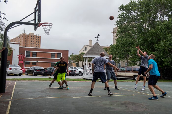 Members of the Coast Guard play basketball during the Coast Guard birthday celebration Aug. 4, 2014, at U.S.C.G. Sector Charleston, S.C. Members of the Coast Guard and their families celebrated the 224th birthday of the Coast Guard, the United States’ oldest continuous sea-going service. (U.S. Air Force photo/Senior Airman George Goslin)