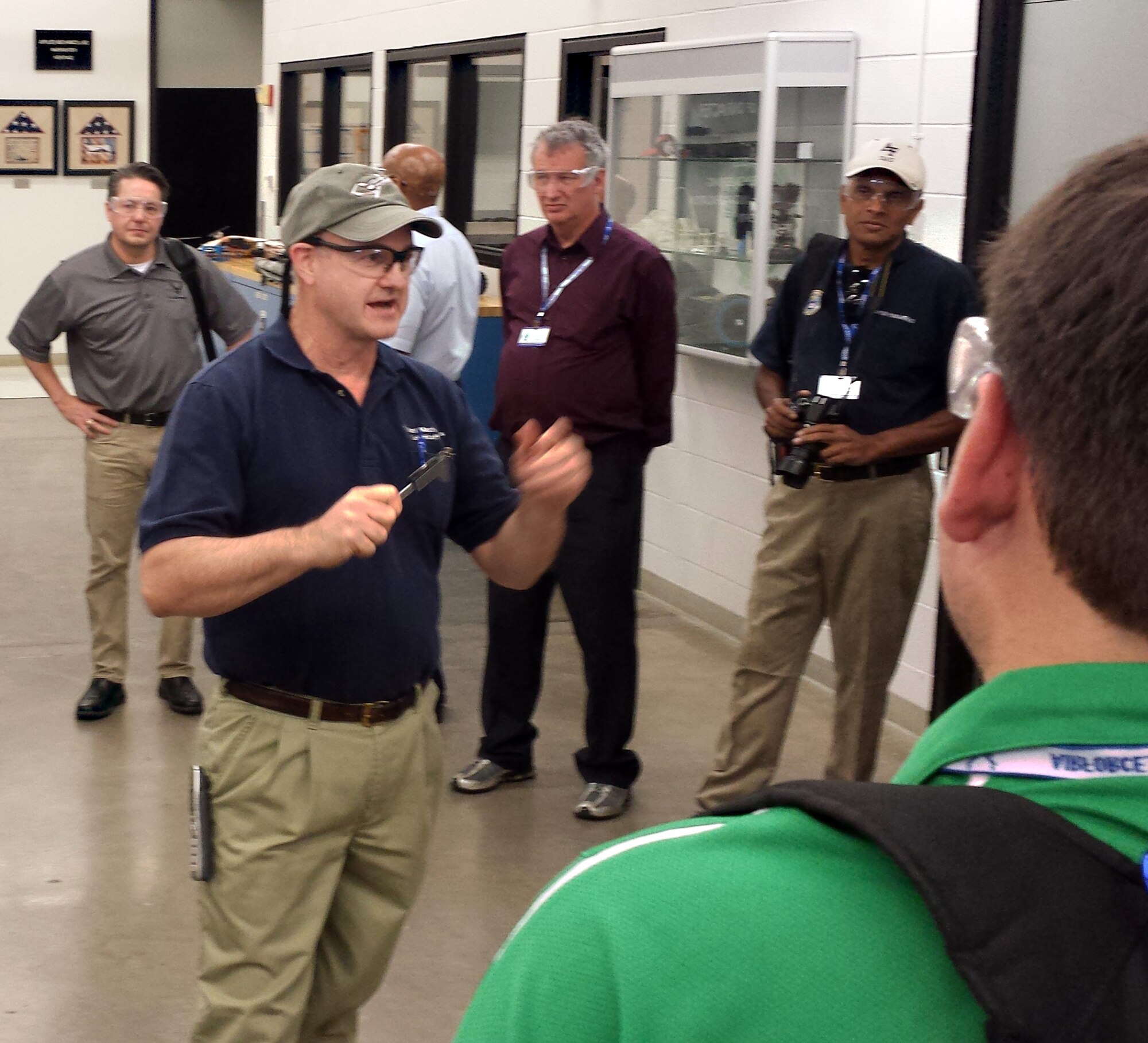 Mr. David Arrington, a technical laboratory assistant, explains a tensile strength test he is performing for STEM teachers from across the country during their visit to the Academy Aug. 4. During the visit, teachers from 24 states attended character and leadership classes to learn how to better inspire students in their respective states. (U.S. Air Force photo/Harry Lundy)
