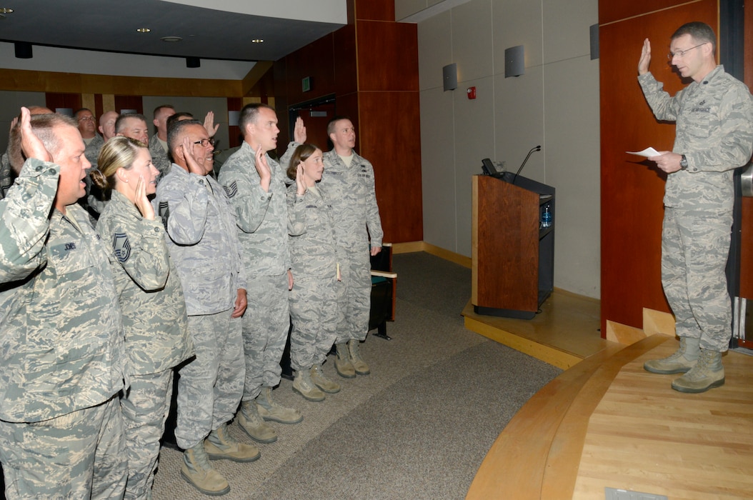 Lt. Col. Jonathan Boyd, vice wing commander of the 151st Air Refueling Wing, administers the Inspector General Oath of Office to more than 30 Airmen who will become the newest members of the Wing Inspection Team. The team is comprised of a total of 91 Airmen from across the base whose goal is to help ensure unit readiness by performing inspections and evaluations for the new Commander’s Inspection Program. The Utah Air National Guard is expected to undergo a Unit Effectiveness Inspection under the program in July 2015. (Utah Air National Guard photo by Staff Sgt. Joe Davis/RELEASED)