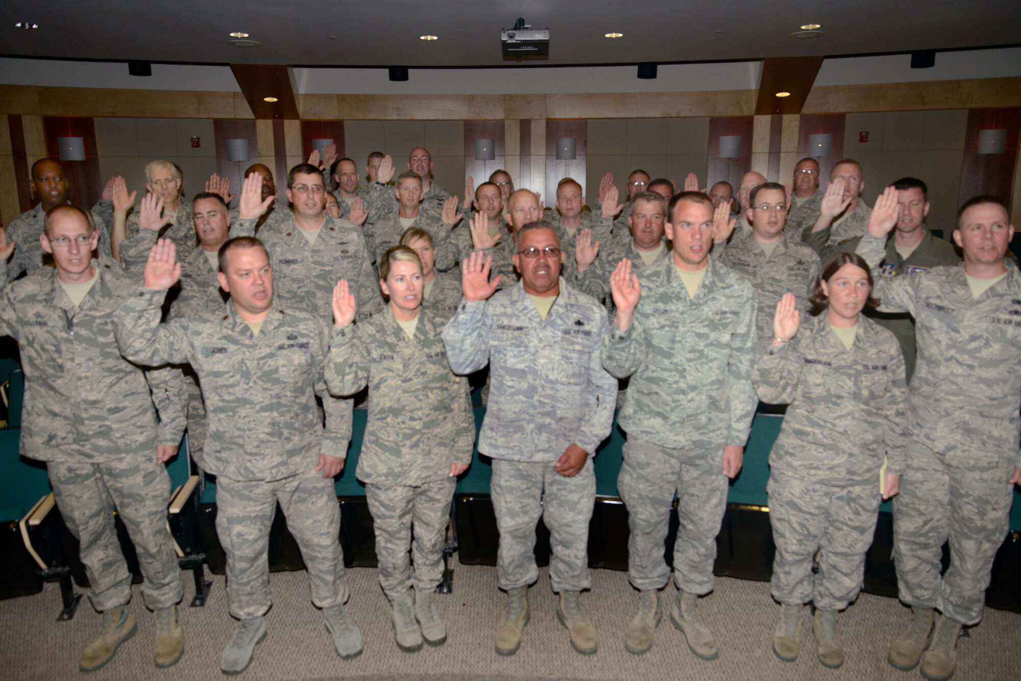 More than thirty Airmen from the Utah Air National Guard take the Inspector General Oath of Office to become the newest members of the Wing Inspection Team. The team is comprised of a total of 91 Airmen from across the base whose goal is to help ensure unit readiness by performing inspections and evaluations for the new Commander’s Inspection Program. The Utah Air National Guard is expected to undergo a Unit Effectiveness Inspection under the program in July 2015. (Utah Air National Guard photo by Staff Sgt. Joe Davis/RELEASED)