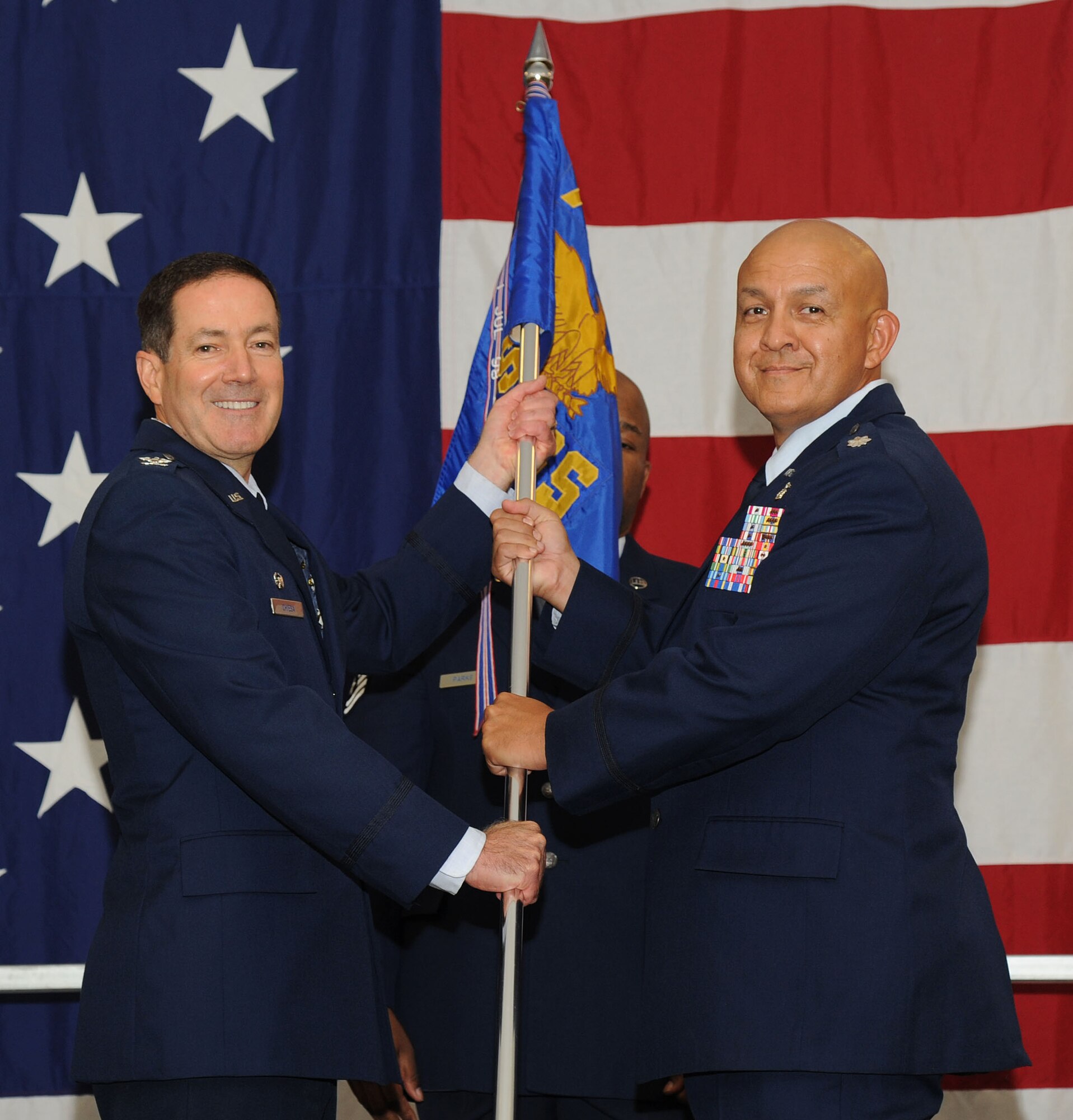 VANCE AIR FORCE BASE, Okla. -- Col. David Chiesa, the 71st Medical Group commander, hands the 71st Medical Support Squadron guidon to Lt. Col. Elijio Venegas during an assumption-of-command ceremony Aug. 1 at the Armed Forces Reserves Center. Venegas joins Team Vance after a tour as the deputy chief Pacific Air Forces Medical Readiness Division at Joint Base Hickam, Hawaii. (U.S. Air Force photo/Staff Sgt. Nancy Falcon)  