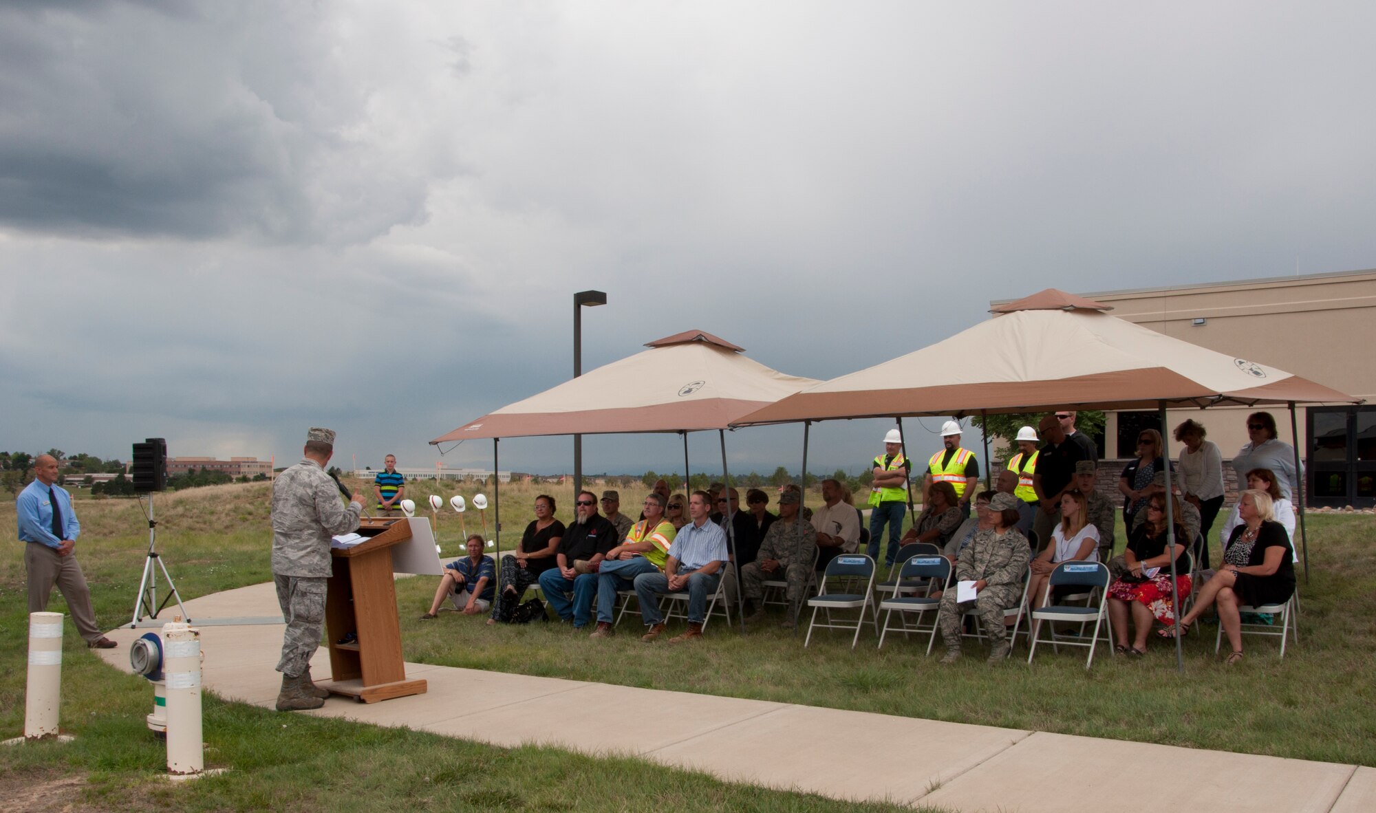 Col. John Wagner, 460th Space Wing commander, speaks during a ground breaking ceremony for a new accessible community park and an accessible playground Aug. 5, 2014, at the chapel on Buckley Air Force Base, Colo. The community park will be located near the chapel, and the accessible playground will be a renovation of a current playground area. The projects, which are estimated to cost approximately $500,000, are scheduled to be complete in September. (U.S. Air Force photo by Tech. Sgt. Kali L. Gradishar/Released)