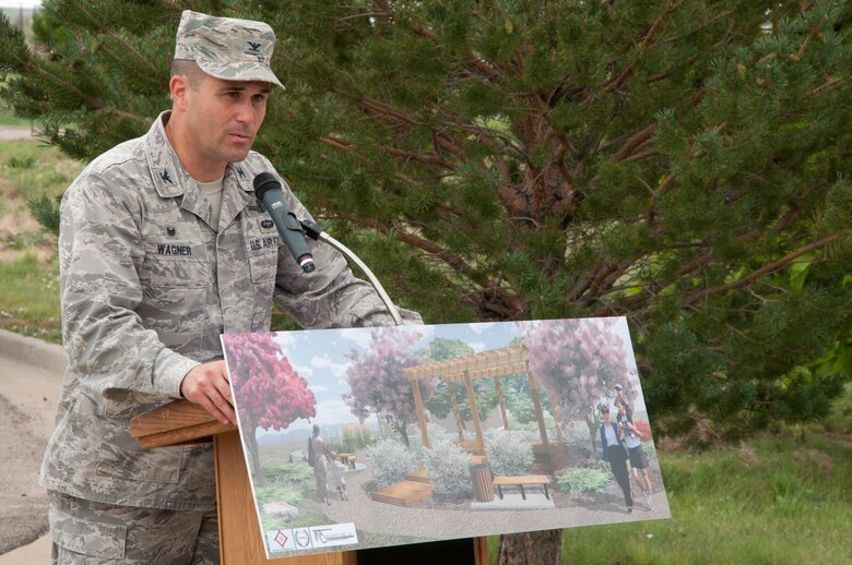 Col. John Wagner, 460th Space Wing commander, speaks during a ground breaking ceremony for a new accessible community park and an accessible playground Aug. 5, 2014, at the chapel on Buckley Air Force Base, Colo. The community park will be located near the chapel, and the accessible playground will be a renovation of a current playground area. The projects, which are estimated to cost approximately $500,000, are scheduled to be complete in September. (U.S. Air Force photo by Tech. Sgt. Kali L. Gradishar/Released)