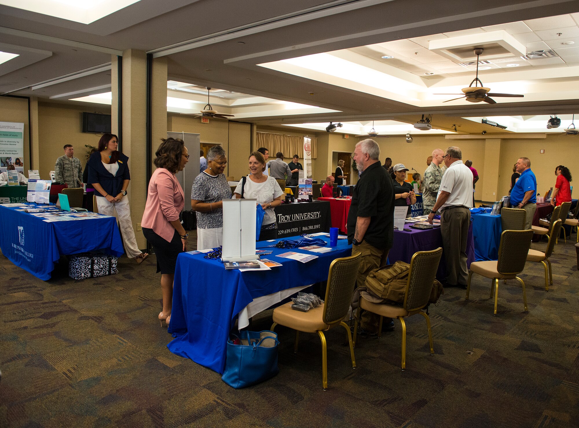 Moody Airmen and guests attend the annual Education Fair at Moody Air Force Base, Ga., Aug. 6, 2014.  The fair hosted 22 different schools that offered traditional and online programs from associate to doctorate degrees. (U.S. Air Force photo by Airman 1st Class Ceaira Tinsley/Released)