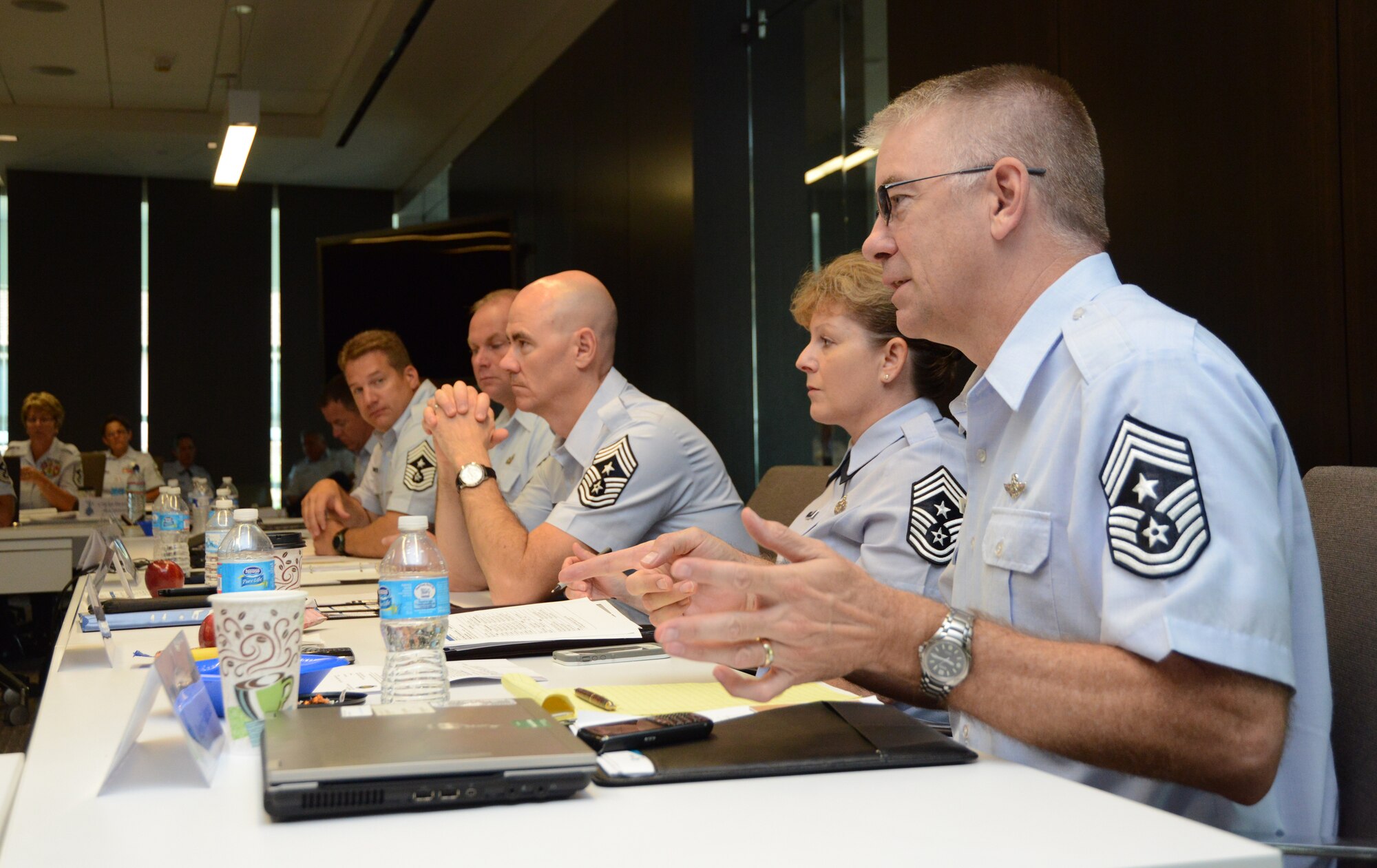 Chief Master Sgt. Mark Forster, command chief master sergeant of the Nebraska Air National Guard, poses a question to the Air National Guard's 2014 Outstanding Airmen of the Year during the Enlisted Field Advisory Council meeting at the Air National Guard Readiness Center on Joint Base Andrews, Md., Aug. 5, 2014, as part of Focus on the Force week. The OAY Airmen bring the perspective of the 91,000 enlisted Airmen across the ANG to address challenges facing the enlisted force. (U.S. Air National Guard photo by Senior Airman John E. Hillier/Released)