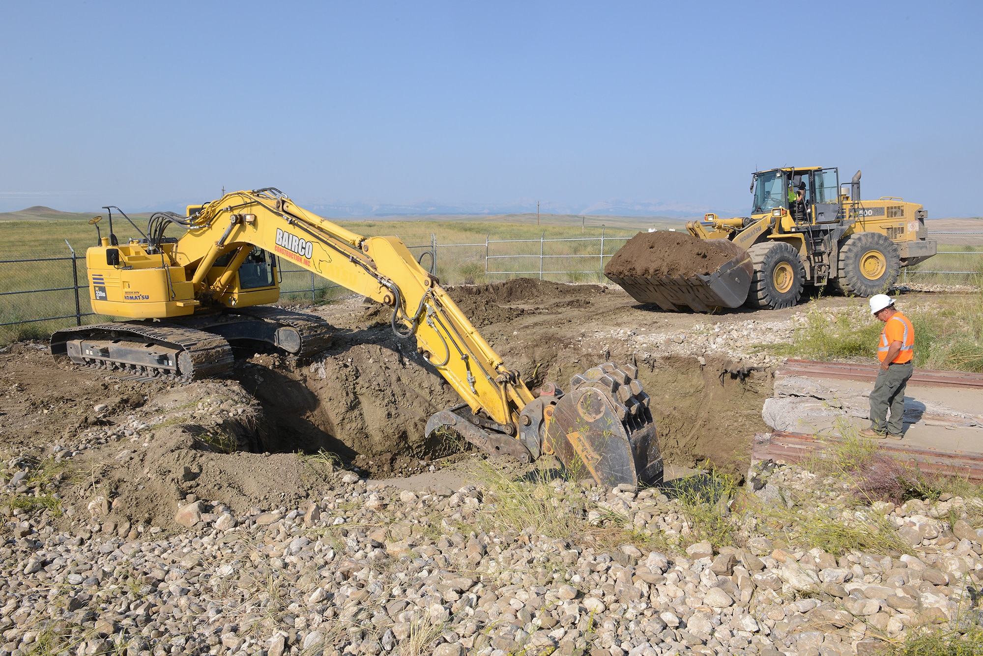 Contractors bury Launch Facility T-49’s dismantled launcher-closure door August 5, 2014, approximately 25 miles west of Conrad, Mont. The site is the last of 50 Minuteman III missile launch silos once operated by the 564th Missile Squadron that are being eliminated from Malmstrom Air Force Base, Mont., in compliance with the New Strategic Arms Reduction Treaty. (Air Force photo/Senior Airman Katrina Heikkinen)