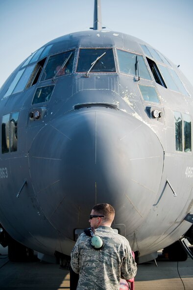U.S. Air Force Staff Sgt. Anthony Eads, 723d Aircraft Maintenance Squadron dedicated crew chief, stands in front of HC-130P Combat King, tail number 64-4863, as an air crew prepares it for flight Aug. 6, 2014, at Moody Air Force Base, Ga. The aircraft later began its journey to Davis-Monthan Air Force Base, Ariz., where it will spend the rest of its days in retirement. (U.S. Air Force photo by Staff Sgt. Jamal D. Sutter/Released) 