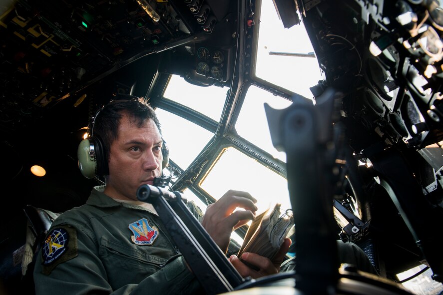 U.S. Air Force Master Sgt. Rogelio Martinez, 71st Rescue Squadron flight engineer, performs a pre-flight inspection on HC-130P Combat King, tail number 64-4863, Aug. 6, 2014, at Moody Air Force Base, Ga. Martinez arrived to Moody in 2008 and became a C-130 flight engineer in 2010. The airframe is the last he will conduct work on before his retirement in early 2015. (U.S. Air Force photo by Staff Sgt. Jamal D. Sutter/Released)