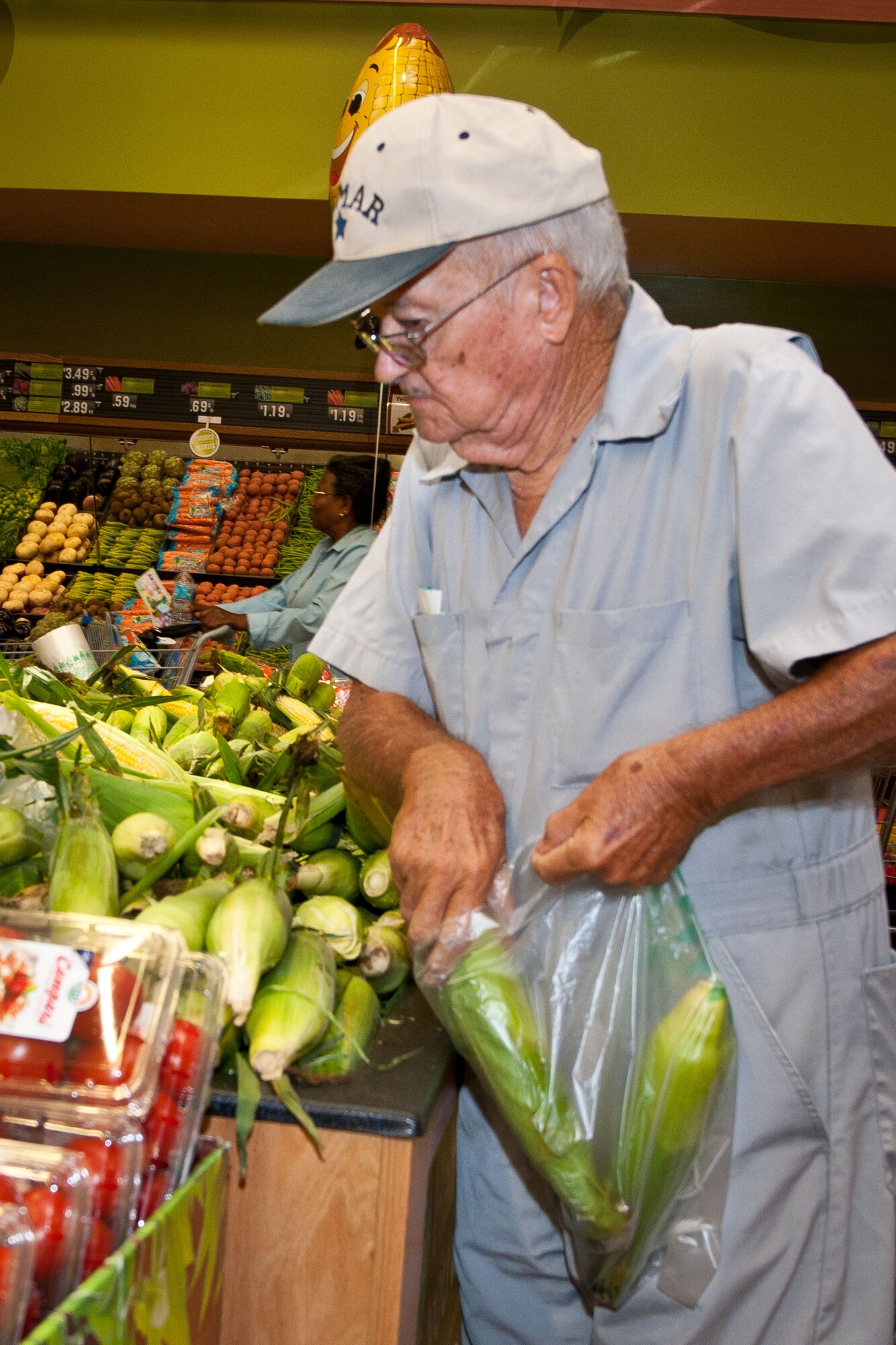 A patron of the new Gunter-Annex commissary shops at the store’s grand opening Aug. 5, 2014. The commissary was approximately a year in the making and boasts a larger more energy efficient store than the previous commissary. It also has a larger produce section with more variety to choose from than the previous store. (U.S. Air Force photo by Donna L. Burnett)