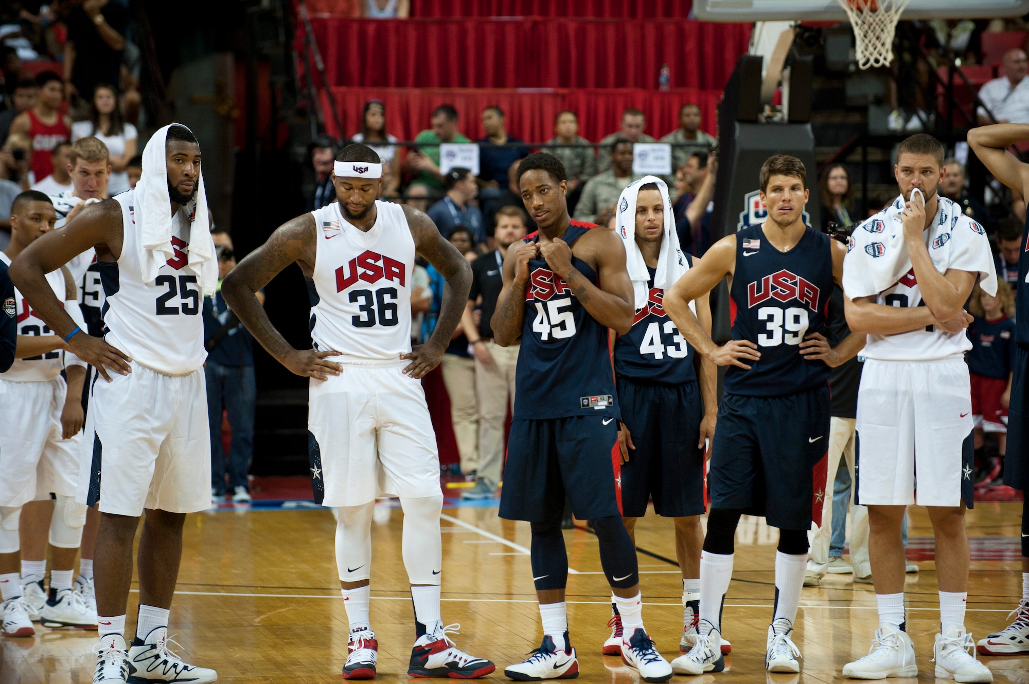 Players on the USA Basketball Men’s National Team react after their teammate Paul George suffered a serious leg injury during the fourth quarter of an intra-squad scrimmage at the Thomas and Mack Center in Las Vegas, August 1, 2014. After George was carted off the court, head coach Mike Krzyzewski addressed the arena stating the game would not continue out of respect to George and his family. (U.S. Air Force photo by Airman 1st Class Thomas Spangler)