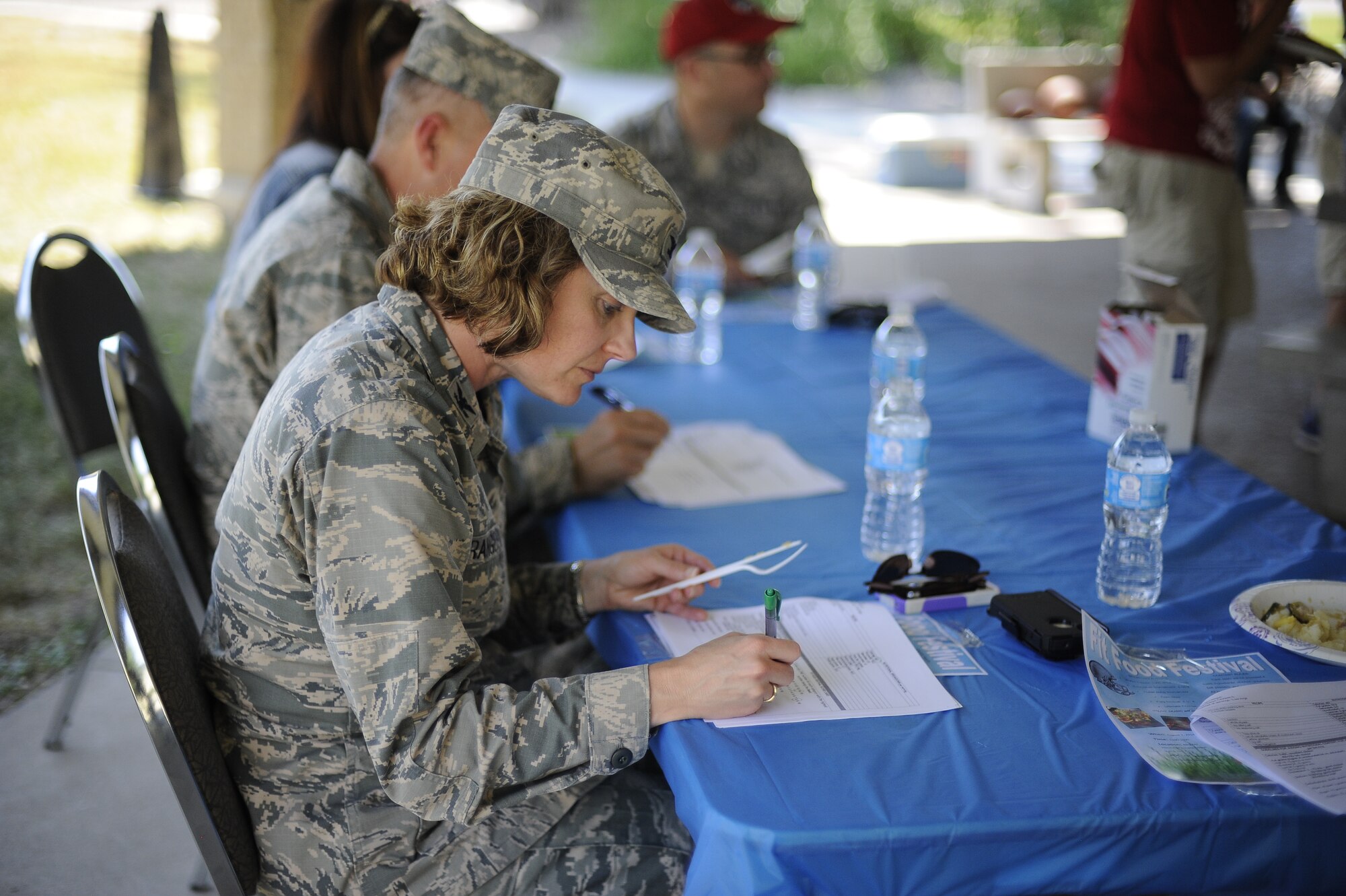 Col. Marné Deranger, 341st Missile Wing vice commander, grades a contestant’s dish during Malmstrom’s Fit Food Festival Aug 1. In order to receive high rankings from the panel of judges, contestant’s dishes were required to be well put together, utilizing only the most essential ingredients, while also meeting a strict health requirement. (U.S. Air Force photo/Airman 1st Class Collin Schmidt)