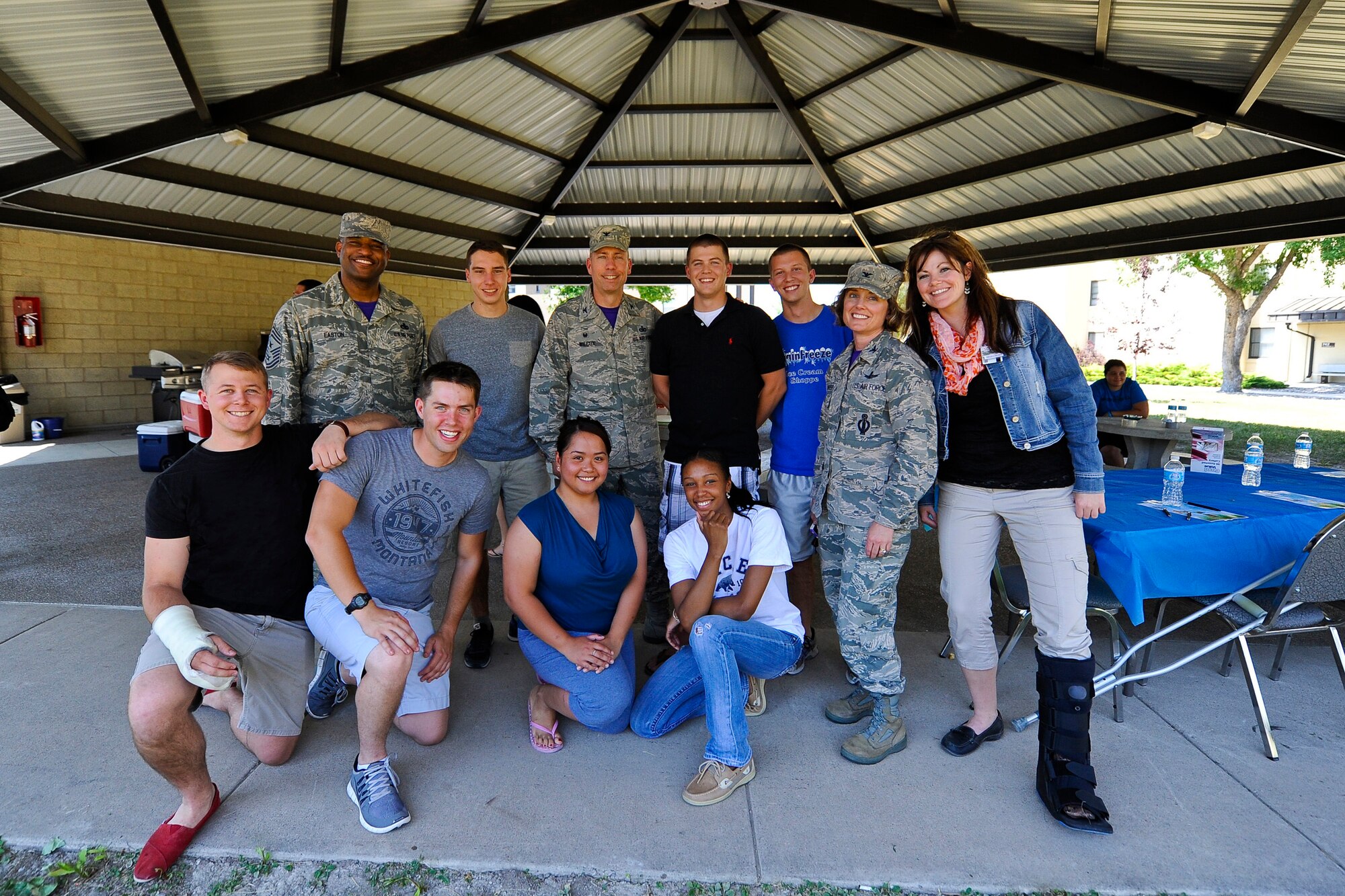 Contestants of Malmstrom’s Fit Food Festival pose for a photograph with the competition’s panel of judges Aug 1. In all, six teams competed against one another to claim the title of “healthiest dish.” (U.S. Air Force photo/Airman 1st Class Collin Schmidt)
