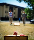 Team Malmstrom members play a game of cornhole during Malmstrom’s Fit Food Festival at Dorm 740’s pavilion Aug 1. In addition to complimentary food, Airmen had the opportunity to partake in more than five different activities and events throughout the course of the day. (U.S. Air Force photo/Airman 1st Class Collin Schmidt)