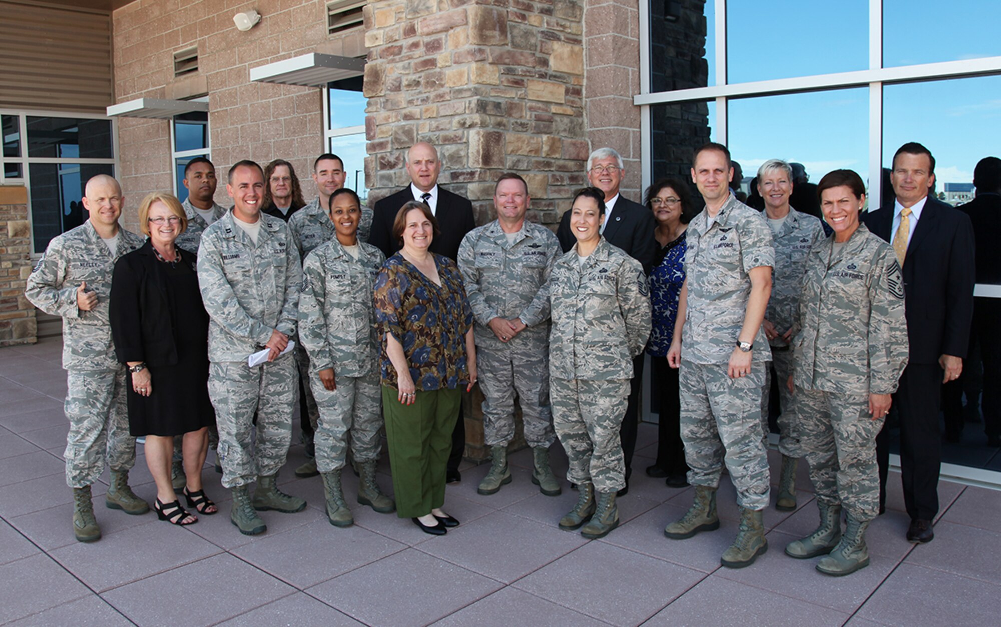 Daniel Sitterly, principal deputy assistant secretary of the Air Force for Manpower and Reserve Affairs, John Fedrigo, deputy assistant secretary of the Air Force Reserve Affairs and Airman Readiness, and Col. Petra McGregor, senior military assistant of Manpower and Reserve Affairs, pose with leaders and staff members at Headquarters Air Reserve Personnel Center Aug. 5, 2014, on Buckley Air Force Base, Colo. (U.S. Air Force photo/Quinn Jacobson)