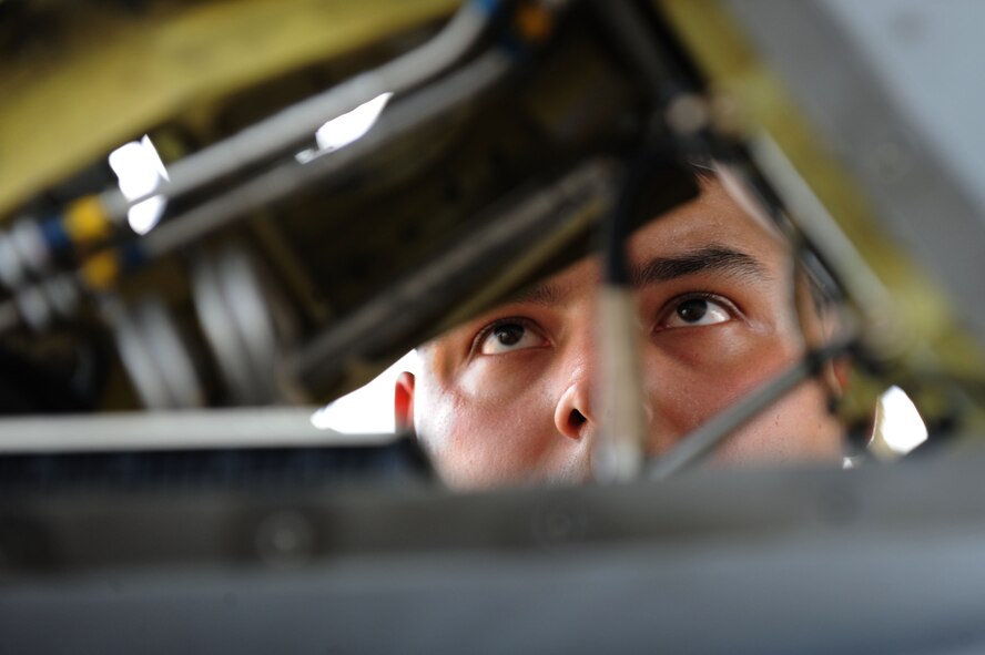 U.S. Air Force Senior Airman Jason Rollins 20th Aircraft Maintenance Squadron, 55th Fighter Squadron tactical aircraft maintainer, examines the rudder of an F-16CM Fighting Falcon at Shaw Air Force Base, S.C., July 30, 2014. The aircraft needed a replacement integrated servo actuator which controls the movement of the rudder. (U.S. Air Force photo by Airman 1st Class Michael Cossaboom/Released)