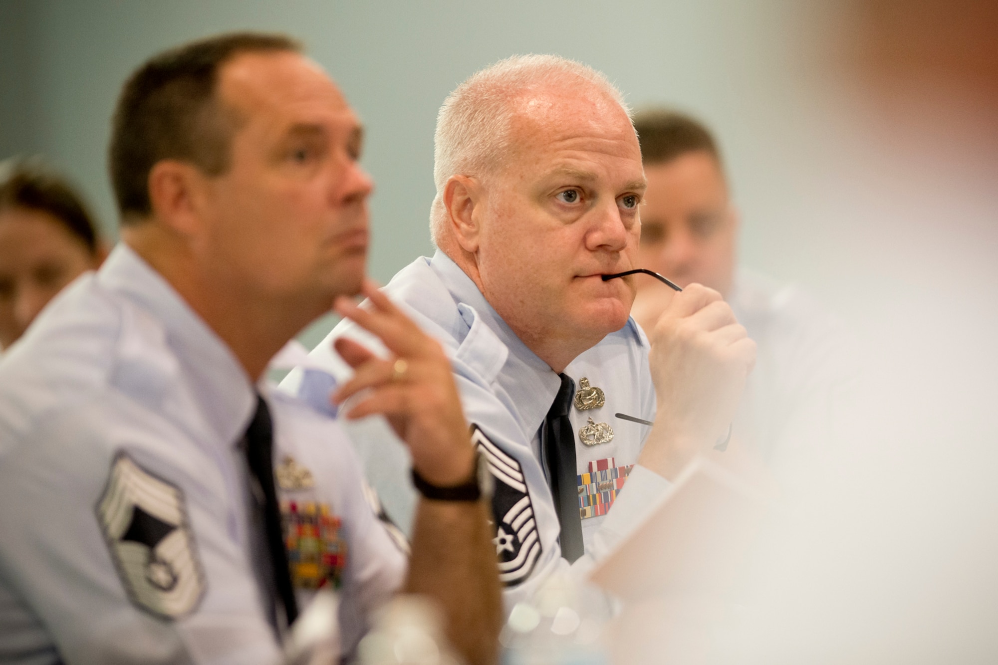 Chief Master Sgt. Dayne Peterson listens to a briefing by Chief Master Sgt. James W. Hotaling, the command chief of the Air National Guard, as he addresses the Chief's Executive Course at Joint Base Andrews, Md. Aug. 4, 2014. The CEC provides recently-promoted chief master sergeants with a broad view of total force operations at a strategic level. (Air National Guard photo by Master Sgt. Marvin R. Preston/Released)