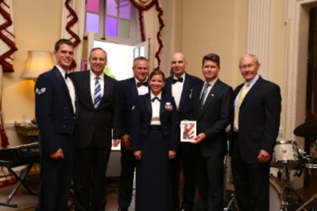 Recently the Ambassador's Jazz Combo performed for the US Ambassador’s Reception  of the US/UK Combined Service Chiefs Conference in London, England.  This photo features the group with (left to right): U.S. Air Force Chief of Staff Mark A. Welsch III, U.S. Ambassador to the U.K. Matthew Barzun, and Chairman of the Joint Chiefs of Staff General Martin E. Dempsey.