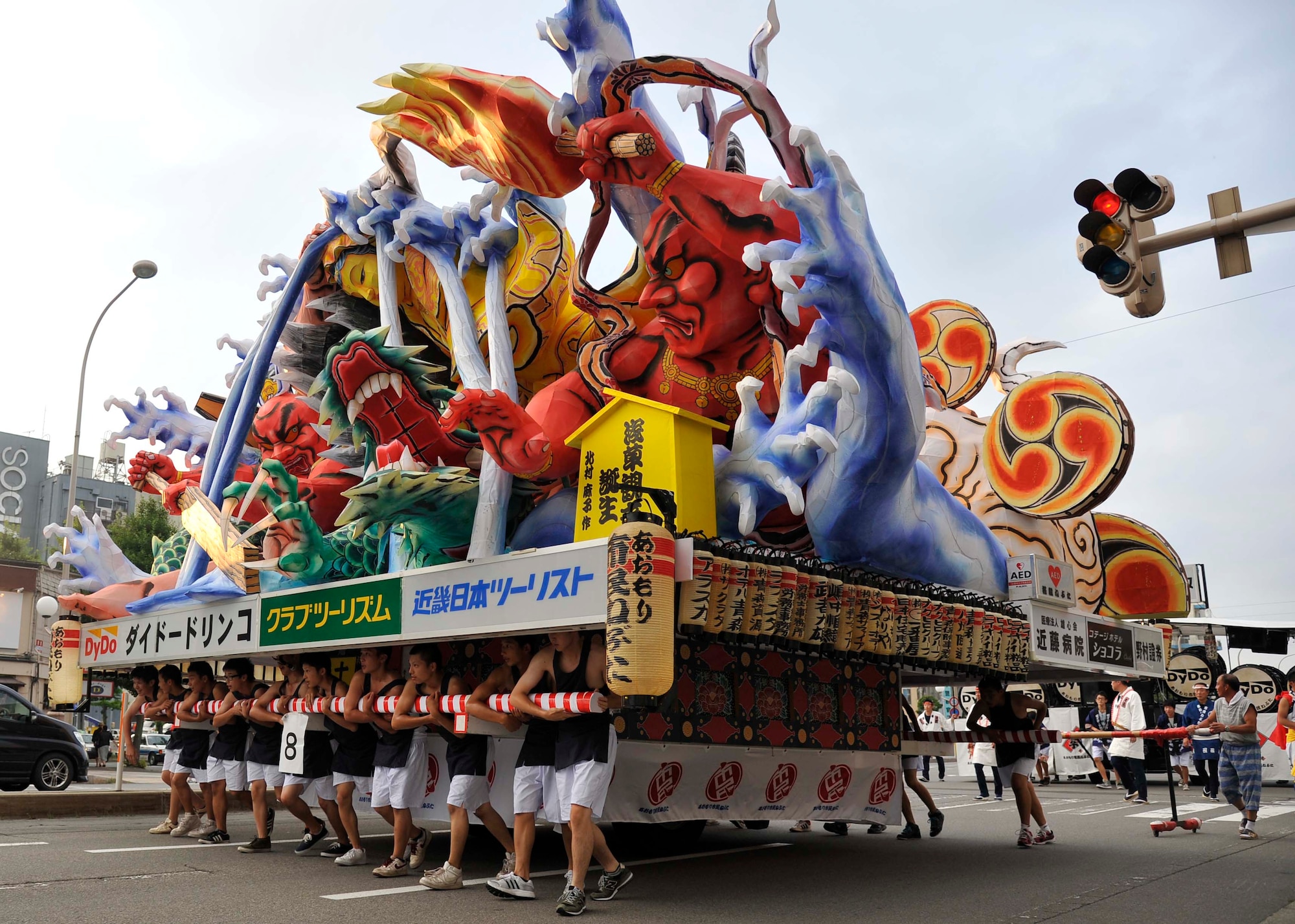 A team of more than 20 Japanese citizens carries a massive Nebuta float during the annual Nebuta Matsuri at Aomori City, Japan, Aug 2. 2014. These large floats are constructed of paper mache and can be as large as 30 feet wide and 20 feet tall, often depicting historical Japanese characters or folktales. Each float has a different theme to its design and many are sponsored by local companies. (U.S. Air Force photo/Airman 1st Class Patrick S. Ciccarone) 