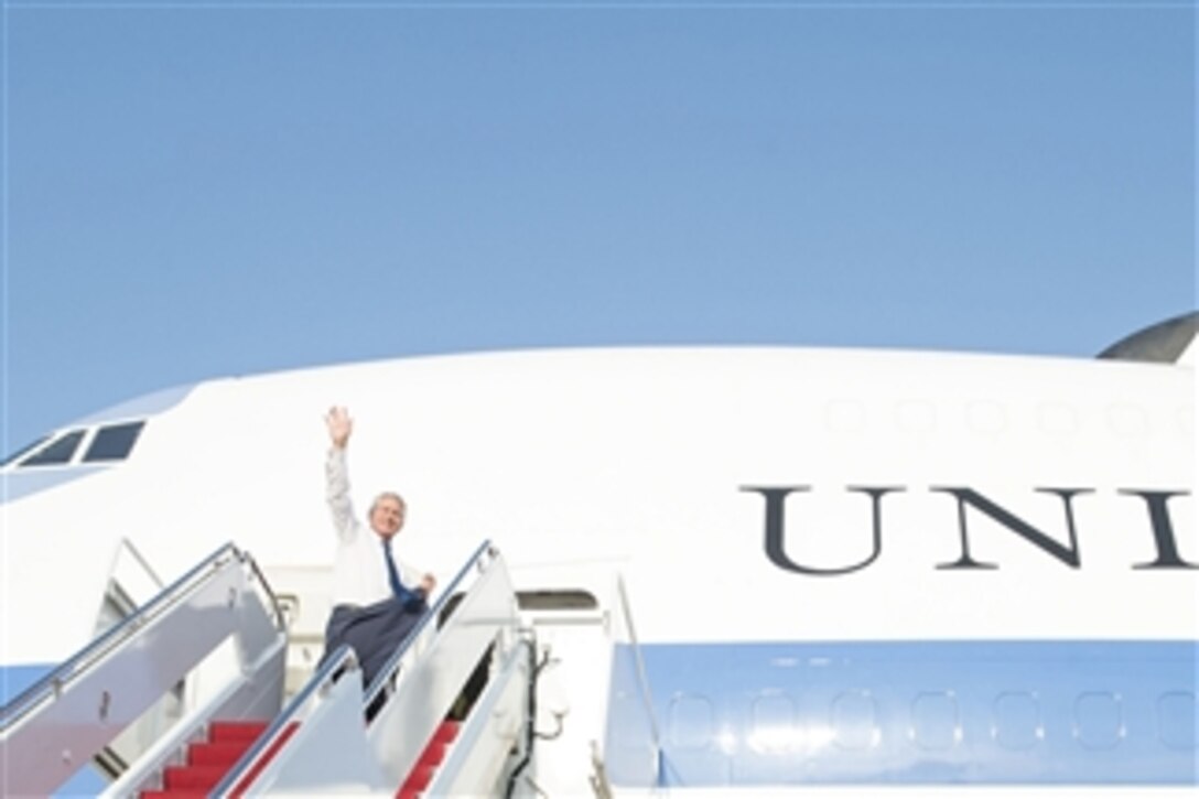 U.S. Defense Secretary Chuck Hagel waves goodbye as he departs Joint Base Andrews, Md., Aug. 5, 2014. Hagel is on an around-the-world trip to meet with leaders in Germany, India and Australia during his 15th international trip as defense secretary. 