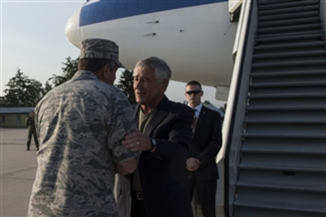 U.S. Defense Secretary Chuck Hagel, right, speaks with U.S. Air Force Gen. Philip M. Breedlove, NATO’s supreme allied commander for Europe and commander of U.S. European Command, as he arrives in Stuttgart, Germany, Aug. 6, 2014. Hagel is on an around-the-world trip to meet with leaders in Germany, India and Australia during his 15th international trip as defense secretary.