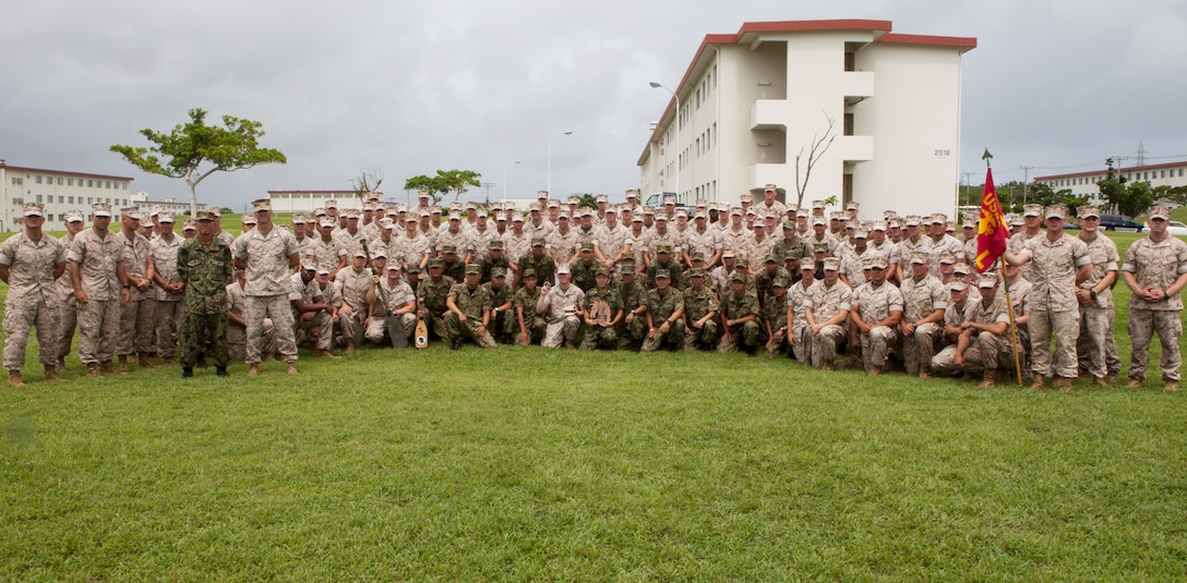 U.S Marines assigned to Battalion Landing Team 3rd Battalion, 5th Marines, 31st Marine Expeditionary Unit (MEU) and the Western Army of the Japan Ground Self Defense Force attend a ceremony concluding the Japan Observer Exchange Program on Camp Hansen Okinawa, Japan Aug 7, 2014. The JGSDF soldiers worked side-by-side with the Marines of Lima Company, BLT 3/5, 31st MEU, as part of the JOEP which consists of a wide range of bilateral events focusing on familiarization of large scale amphibious operations. 