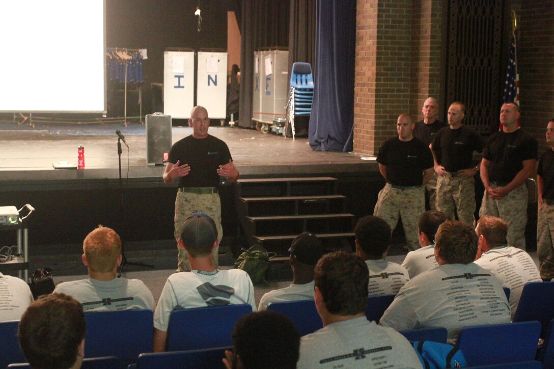 U.S. Marine Corps Gunnery Sgt. Christopher Balderston, the staff noncommissioned officer in charge of Recruiting Sub-Station Xenia, speaks to members of the Xenia High School football team during a leadership seminar conducted at the high school in Xenia, Ohio, July 31, 2014. The seminar was conducted by Marines from Recruiting Station Charleston with the purpose of developing the leadership abilities of the football team by teaching Marine Corps values. (U.S. Marine Corps photo by Sgt. Tyler Hlavac/Released)