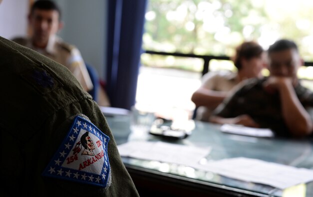 Lt. Col. Eric Burdge discusses goals with members of the Guatemalan air force during a subject matter expert exchange Aug. 4, 2014, in Guatemala City, Guatemala. The SMEE is one of the activities encouraged through the National Guard’s State Partnership Program, which helps foster cooperation and support between the U.S. and Guatemala.Burdge is the Arkansas State Air Surgeon for the Air National Guard. (U.S. Air Force photo/Tech. Sgt. Heather R. Redman)